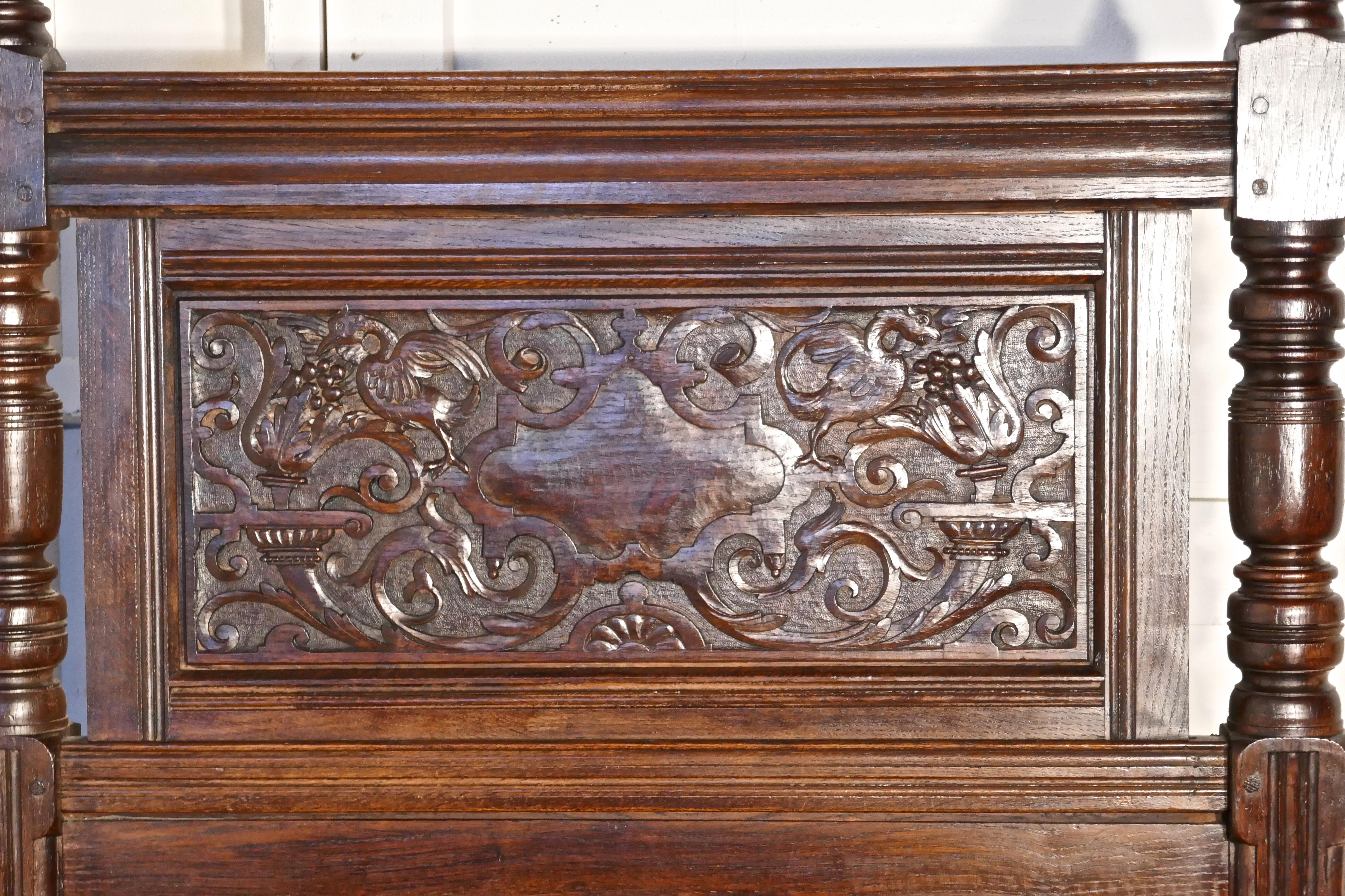 Gothic high carved oak single bed

This Gothic style panelled oak bed has an exquisitely carved headboard, depicting mythical beasts and twining leaves

Both the head and foot board of the bed have turned posts at each side with chunky knobs on