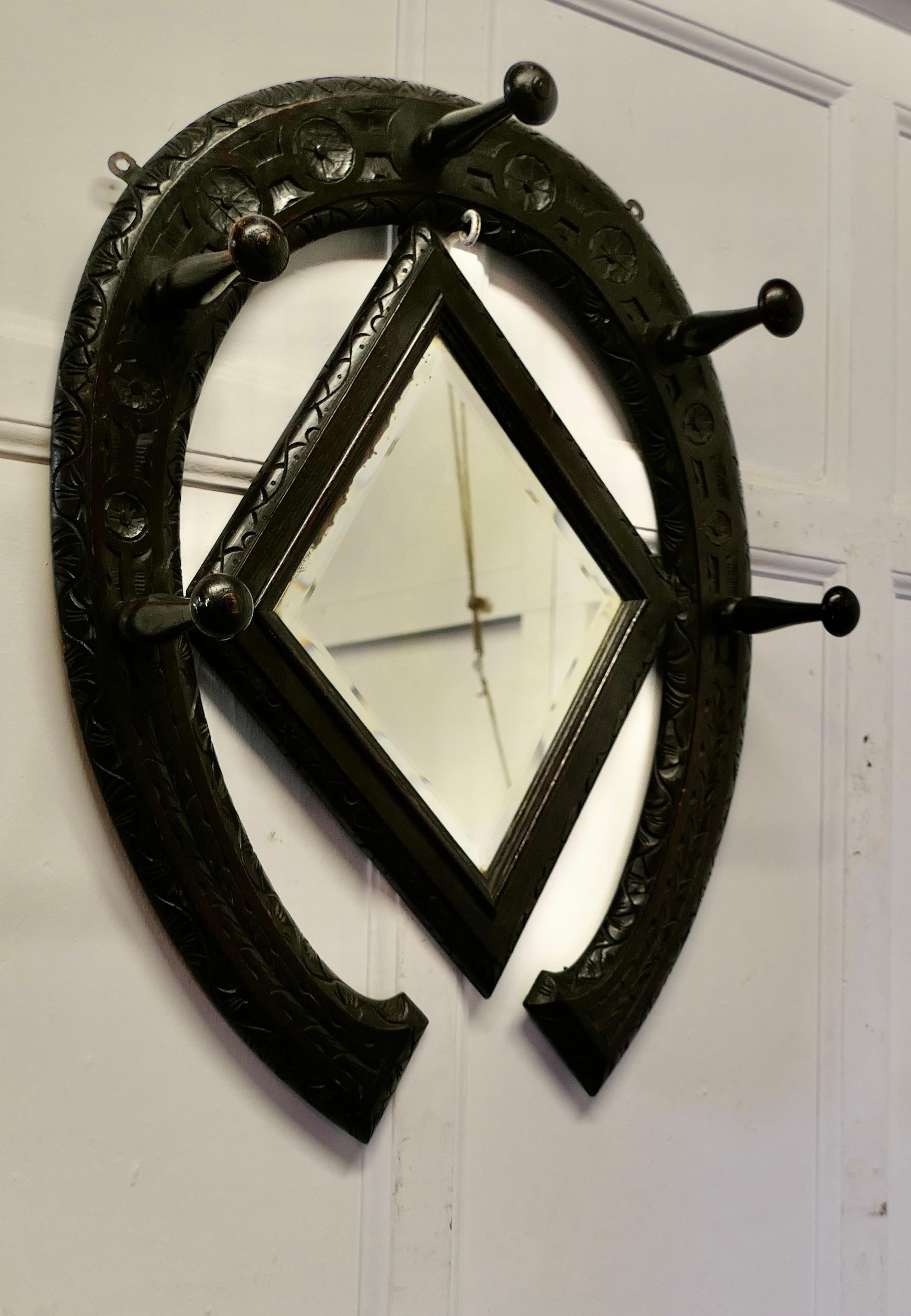 Gothic Horseshoe Coat and Tack Rack with Mirror


A very fine quality piece made and carved in Oak

Beautifully made in the shape of a horseshoe with 5 turned wooden farriers nails forming the hooks, good for coats, hats and tac and a Diamond shaped