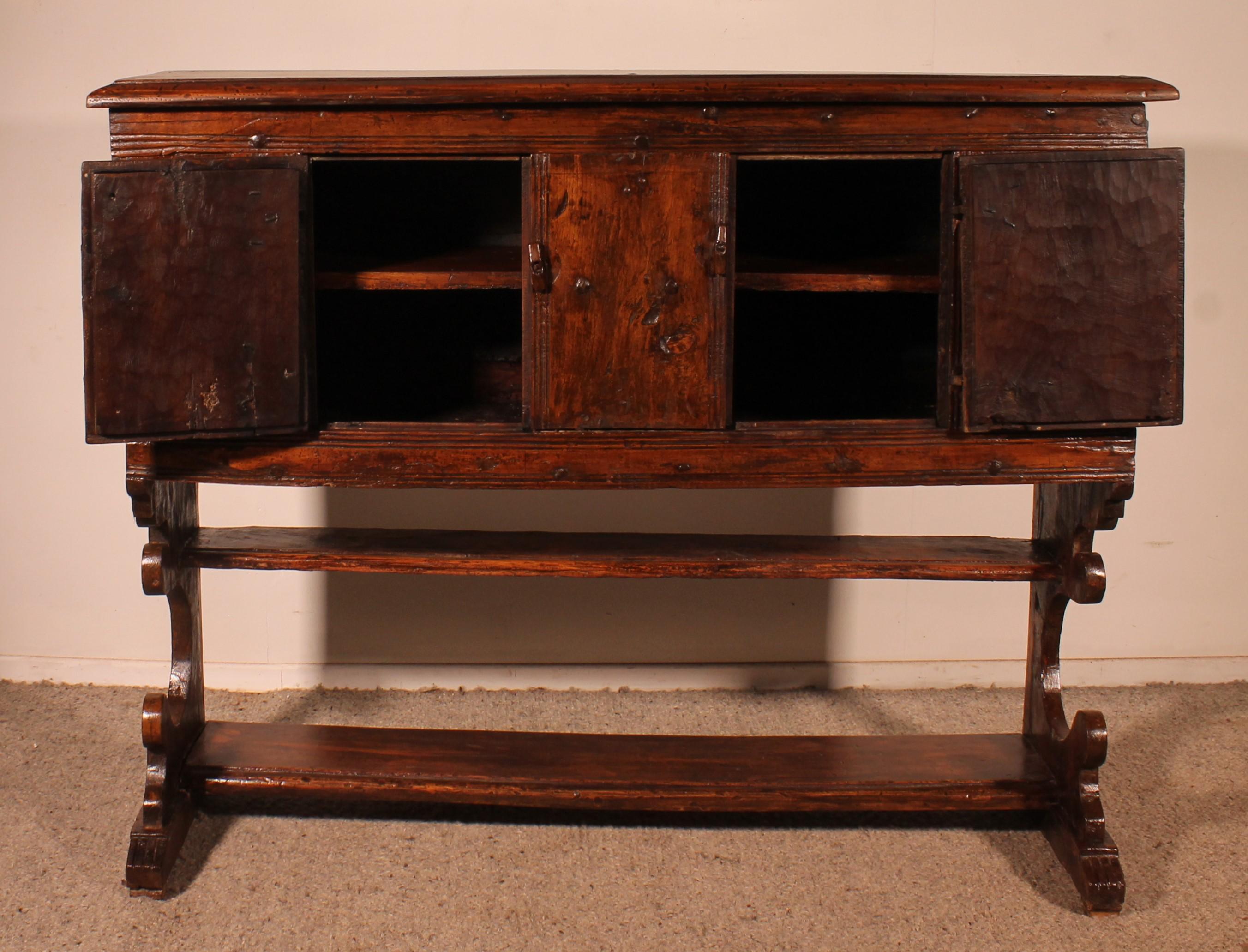 Superb and rare 16th century credenza from the southwest of France with a Gothic influence
The credenza opens with two doors. Very beautiful ironwork with superb Gothic irons fittings

The lower part is composed of two shelves.
Very beautiful carved