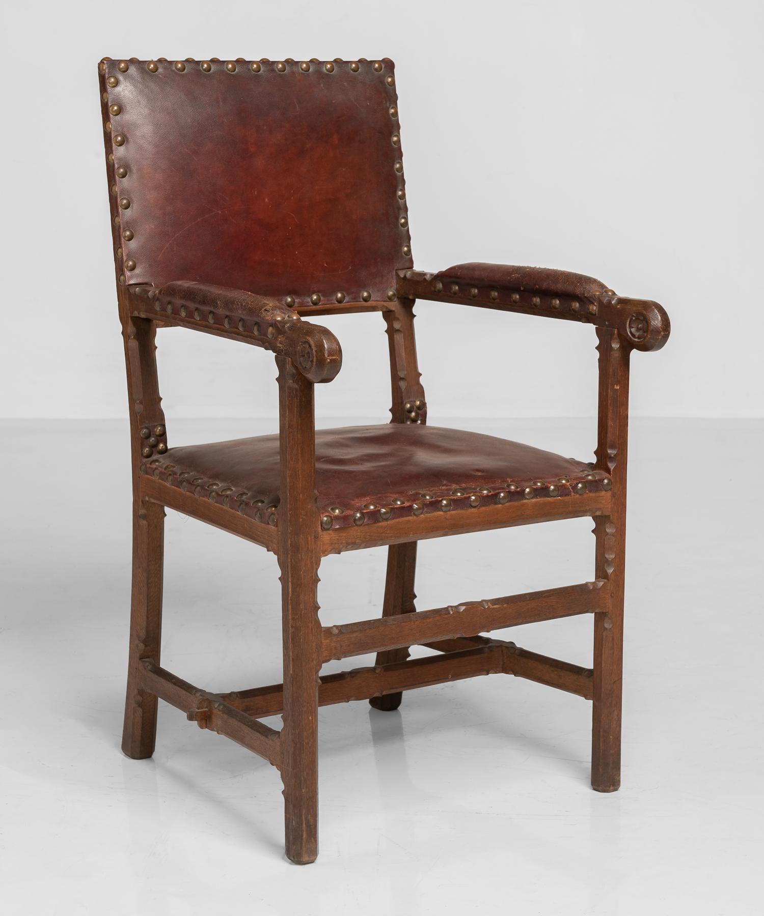 Gothic oak and leather armchair, England, circa 1860.

Beautiful oak frame with unique detailing and original leather upholstery. Attributed to J.P. Seddon.