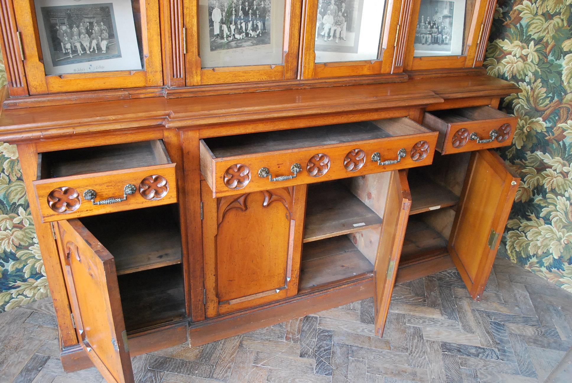 Carved Gothic oak breakfront bookcase For Sale