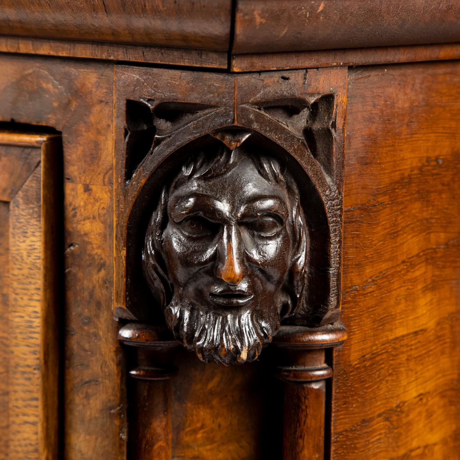 English Gothic oak chest of drawers decorated with carved masks and columns For Sale