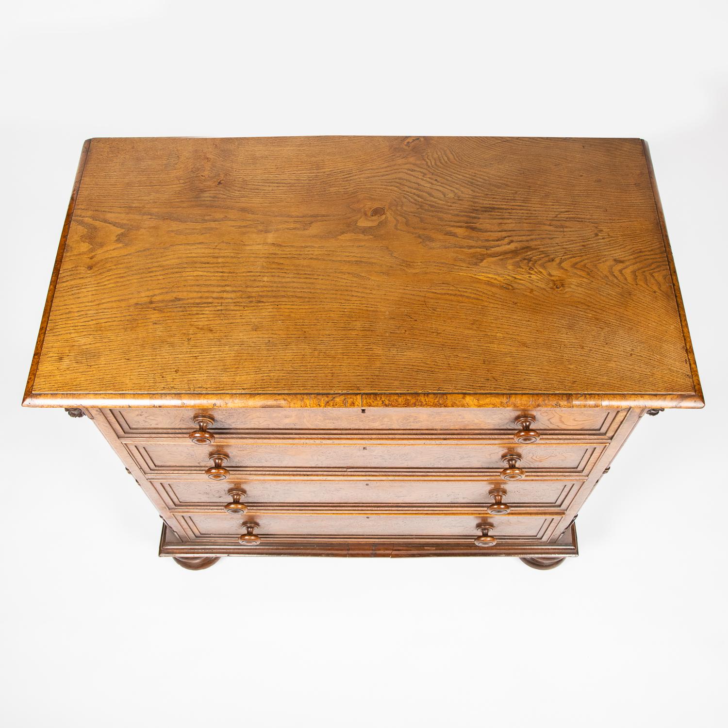 19th Century Gothic oak chest of drawers decorated with carved masks and columns For Sale