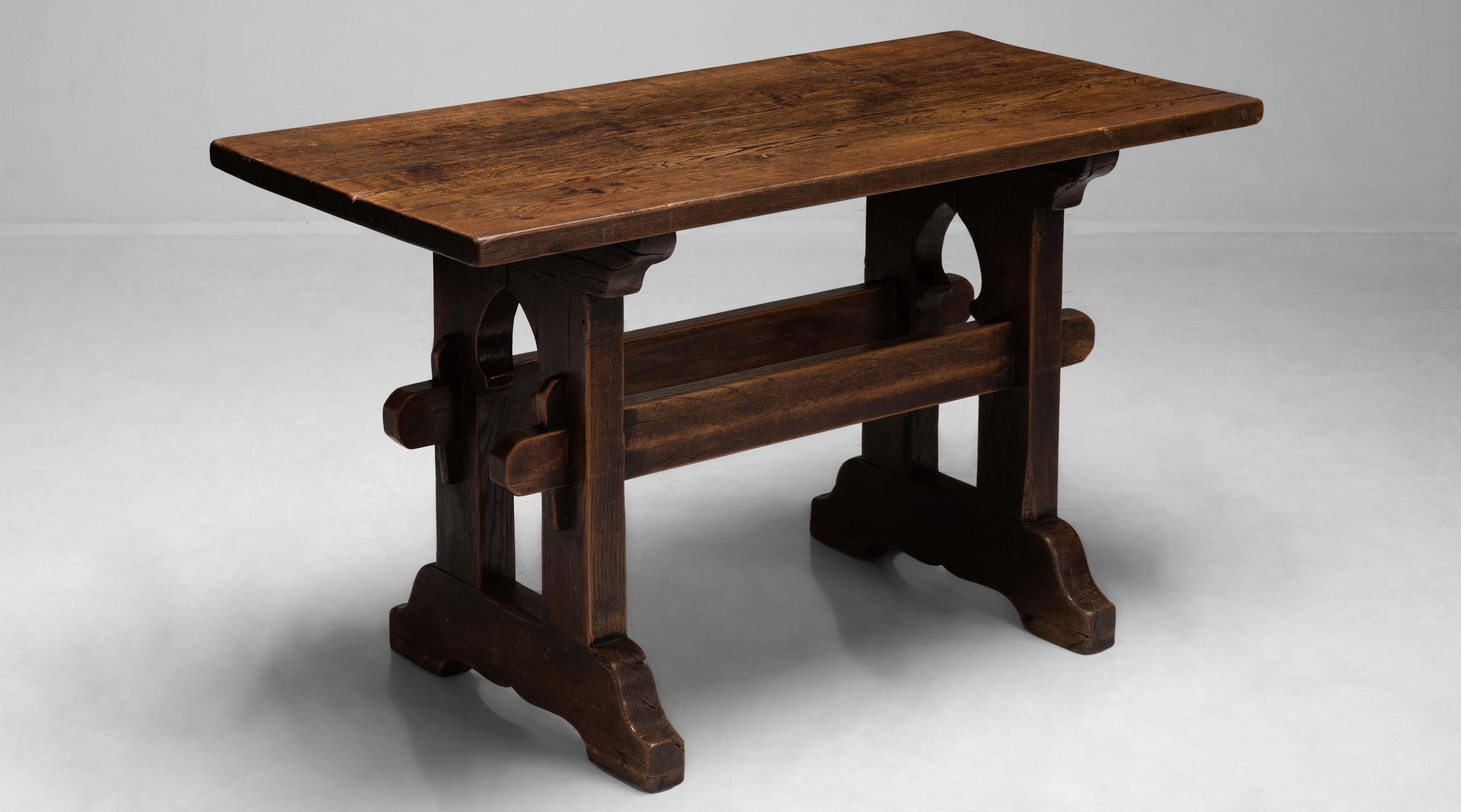 Beautifully carved trestle table with amazing patina.

Measures: 51” W x 25” D x 29.25” H x 28” apron.
