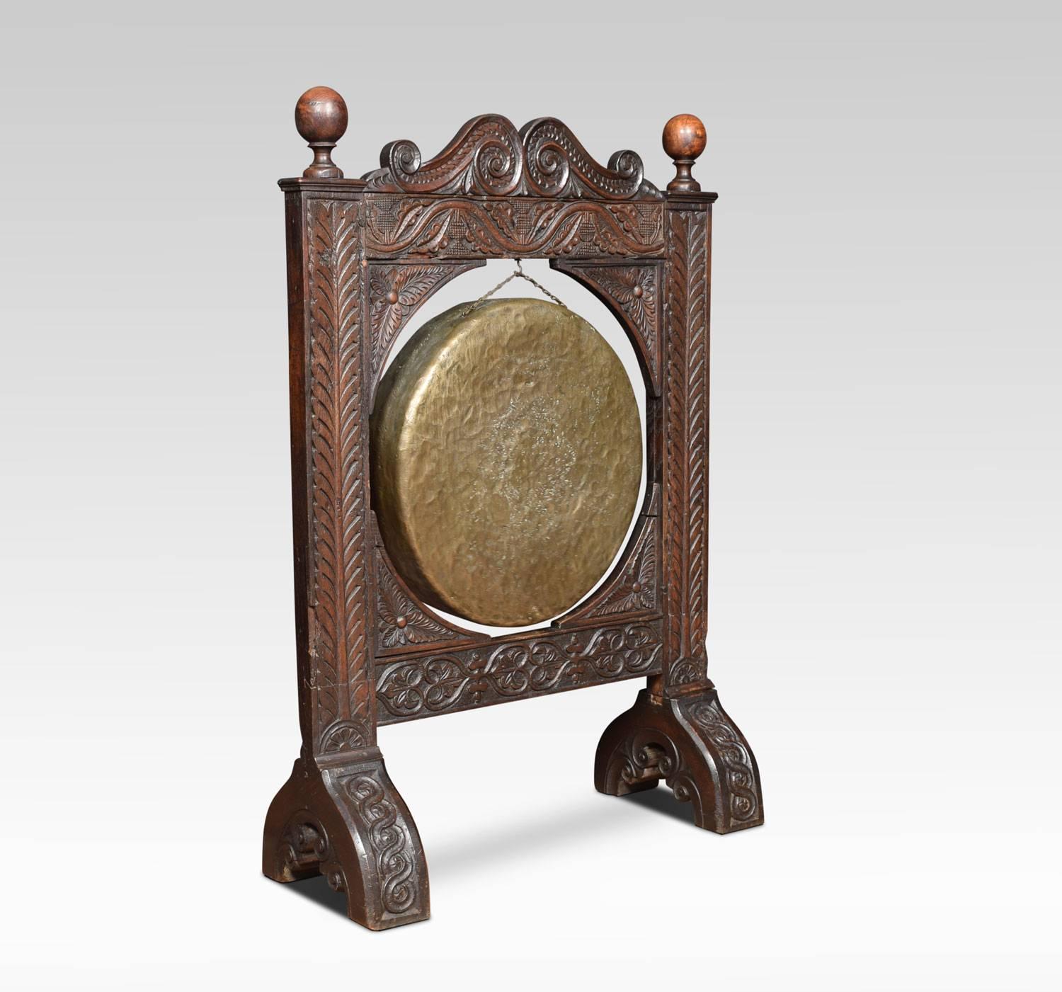 Oak framed Gothic dinner gong and beater. The heavily carved frame containing original brass gong, raised up on four outs-swept legs.
Dimensions:
Height 43 inches
Width 29.5 inches
Depth 12 inches.