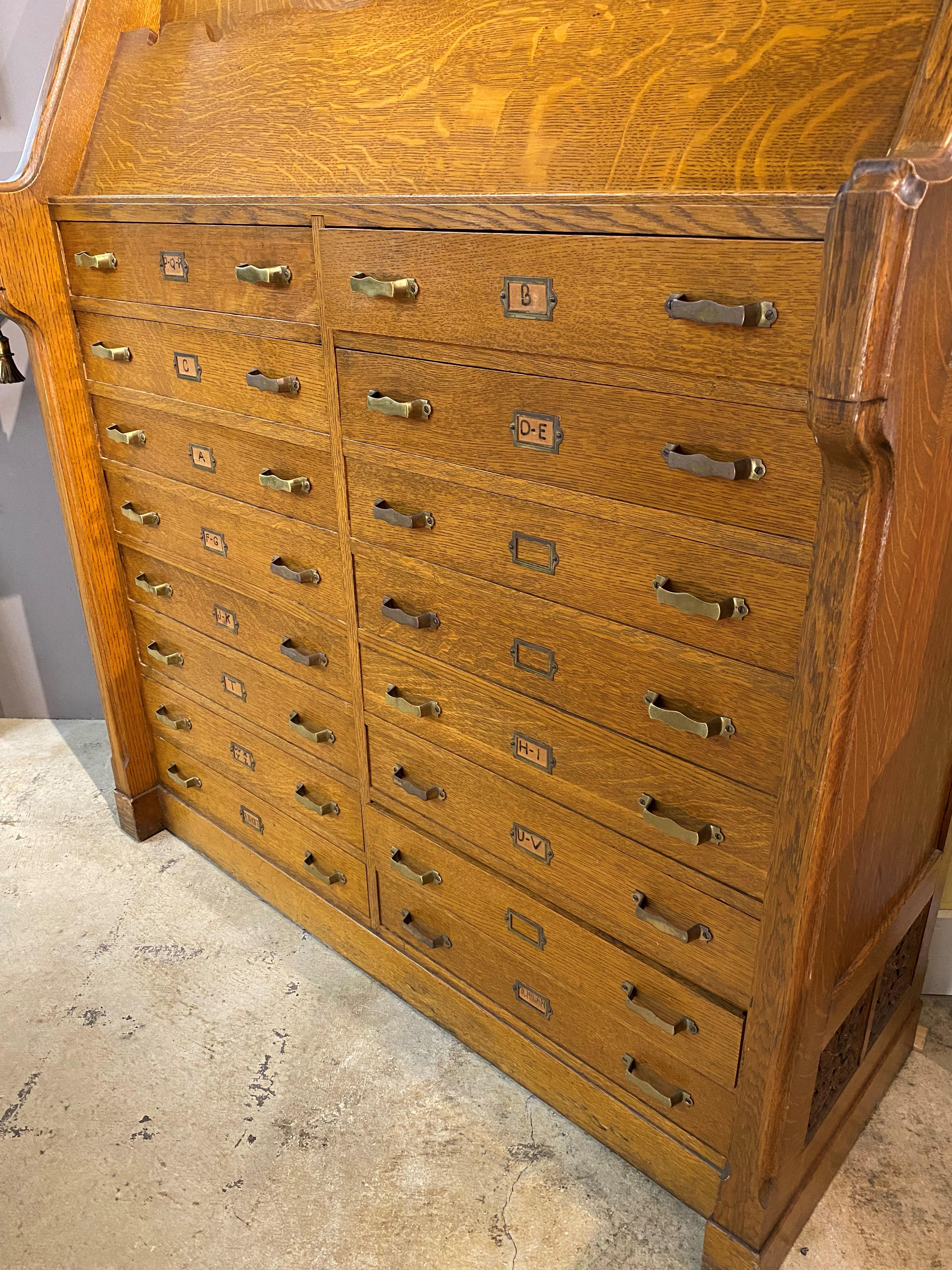 Hand-Carved Gothic Oak Library or Book Display Stand with 16 Drawers circa 1920’s