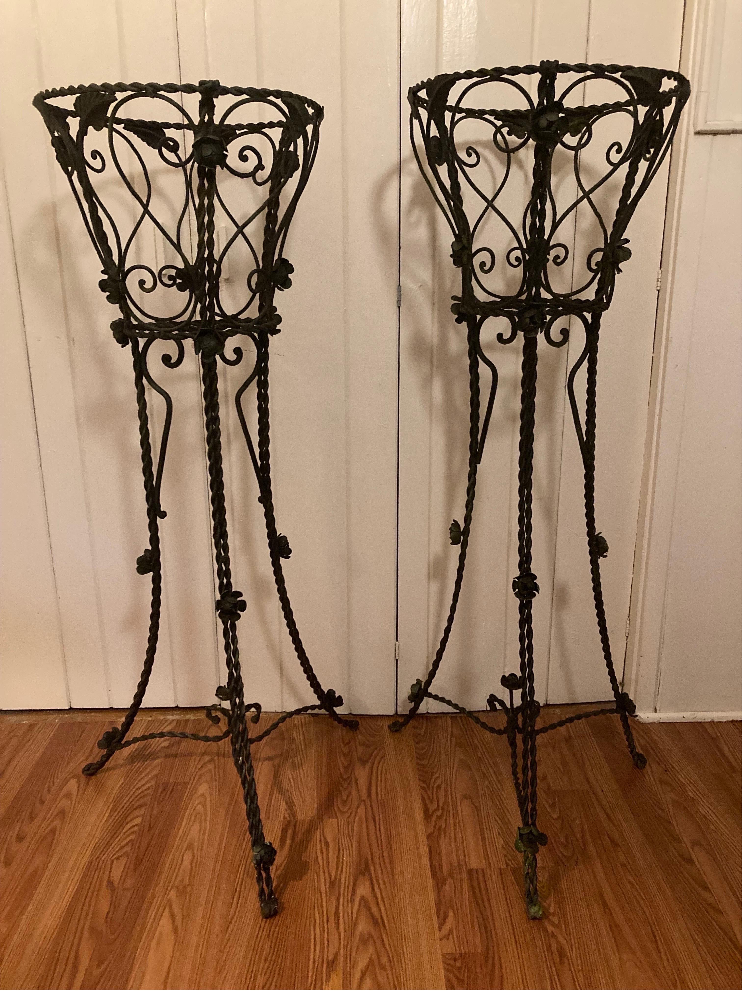 older pair, handmade very large 
50 inches tall with a 16 inch wide basket. rose adornments, subtle green hues throughout… these are great statements pieces, one is about 1 inch shorter than the other
16ʺW × 16ʺD × 50ʺH
