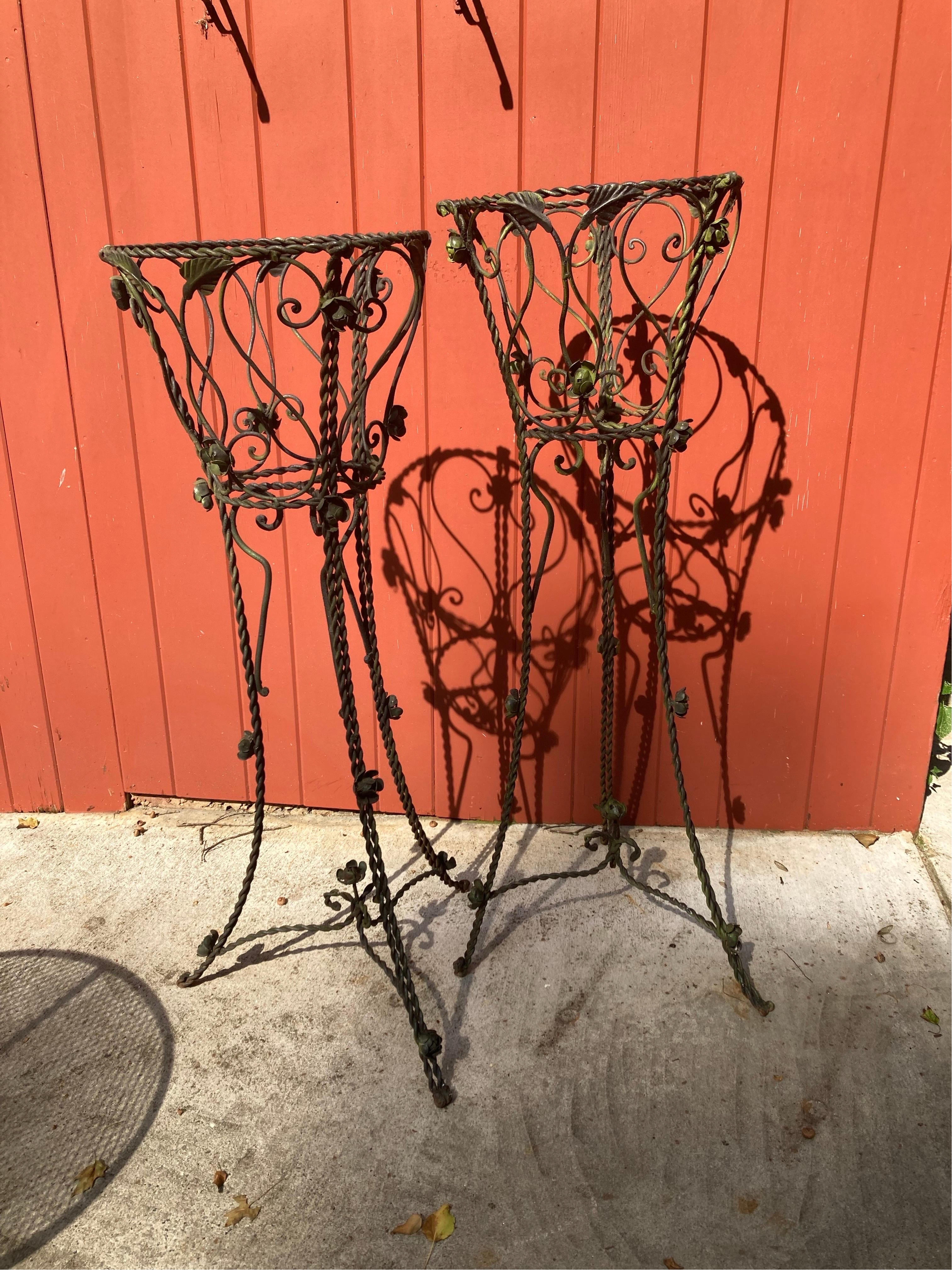 older pair, handmade very large 
50 inches tall with a 16 inch wide basket. rose adornments, subtle green hues throughout… these are great statements pieces, one is about 1 inch shorter than the other
16ʺW × 16ʺD × 50ʺH
