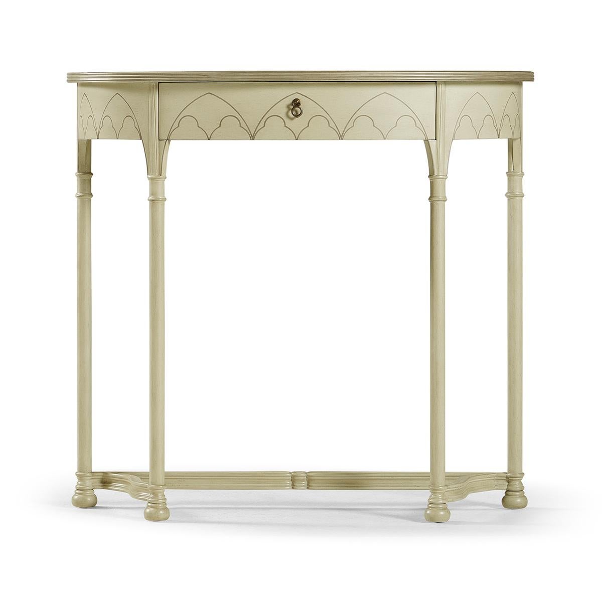 A Gothic painted console table with an antique clary sage finish, in an 18th-century gothic style, the demilune half-round form with fine contrasting inlays to the top and frieze, and legs with painted running floral motifs and