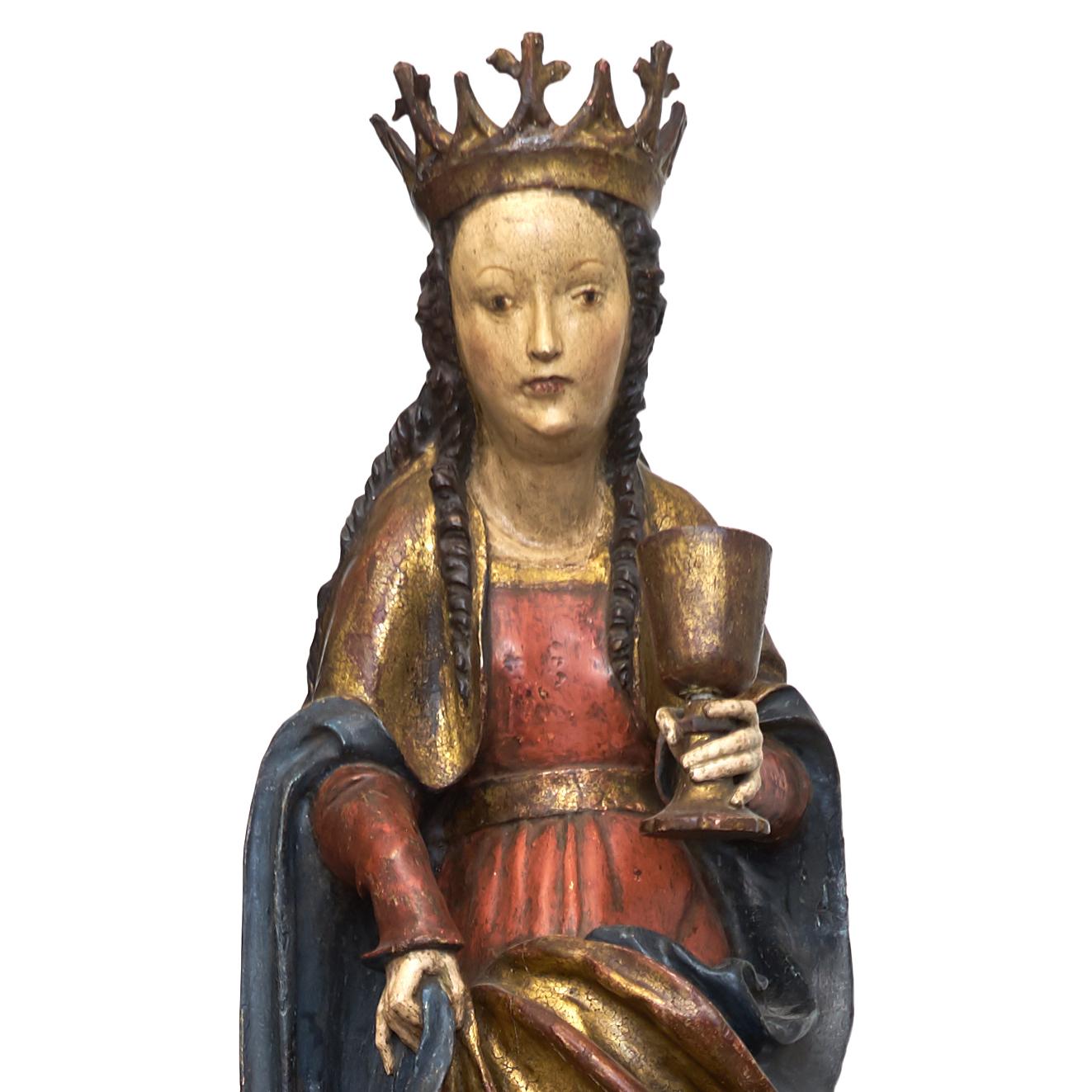 A rare and very fine South German or Austrian Gothic, circa 1500. Polychrome and gilt pinewood sculpture of Maria Magdalena. Maria depicted standing in contrapost, with fine facial features and long curly hair running over her shoulders, wearing a