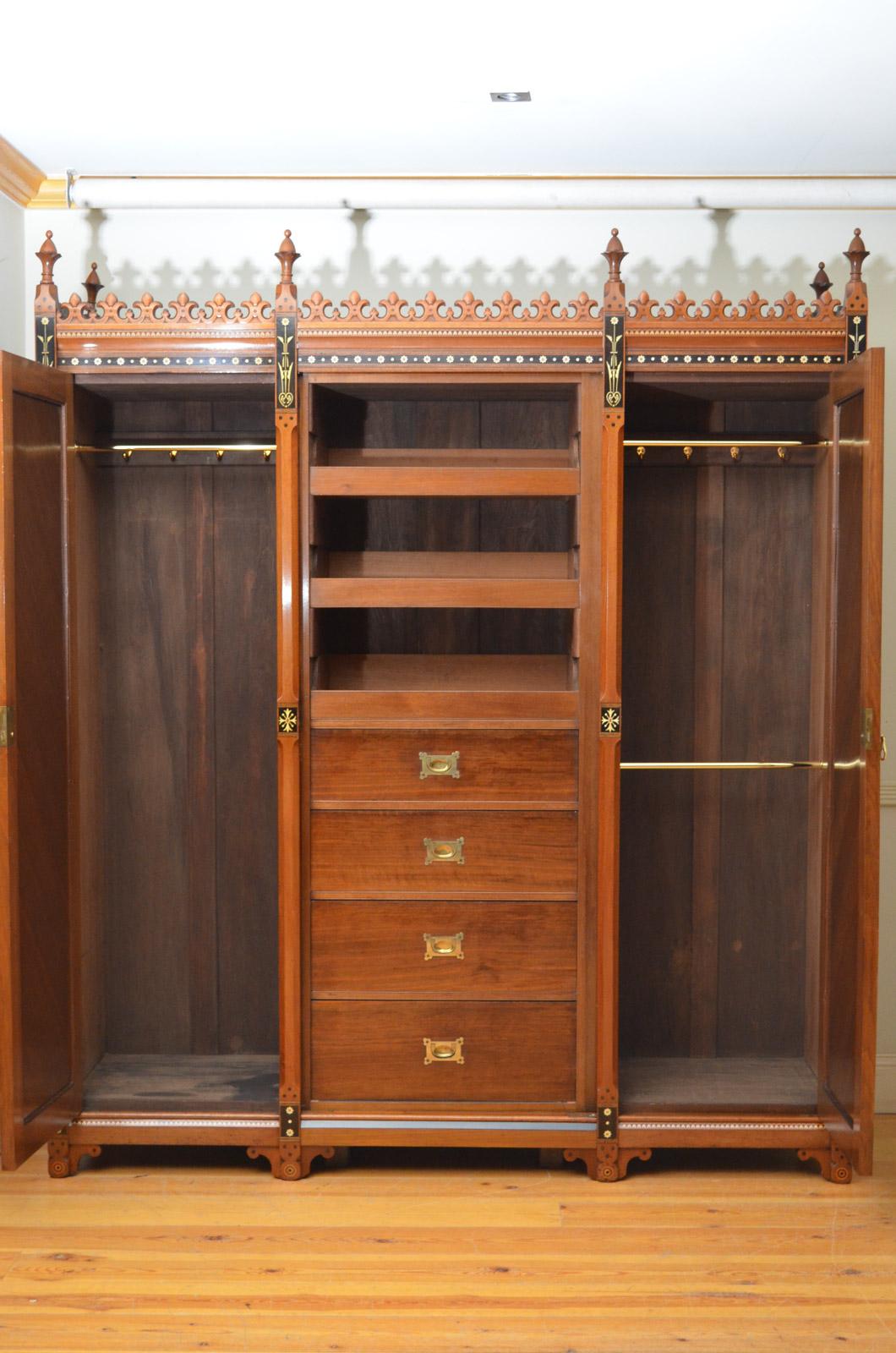 Sn4522 Superb quality walnut and coromandel Victorian 3-door wardrobe, having finely carved castellated cornice above finely inlaid frieze and centre mirrored door with original mirror with some foxing, enclosing original sliders and drawers, all
