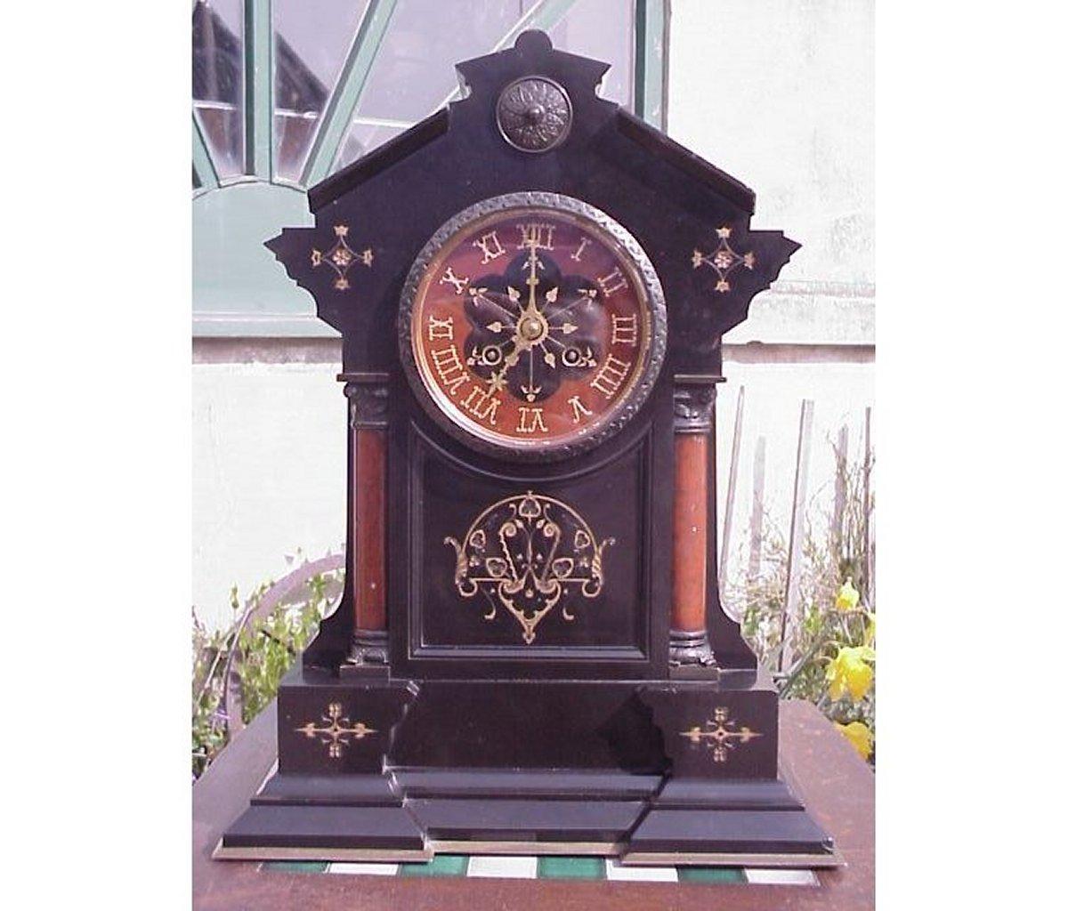 Morris and Co, In the style of, An Aesthetic Movement noir belge and red Marble gilded mantle or bracket clock with an important Gay Vicarino & Co French brass bell striking 8 day movement, stamped 12100.

Of stepped Architectural form with Bronze