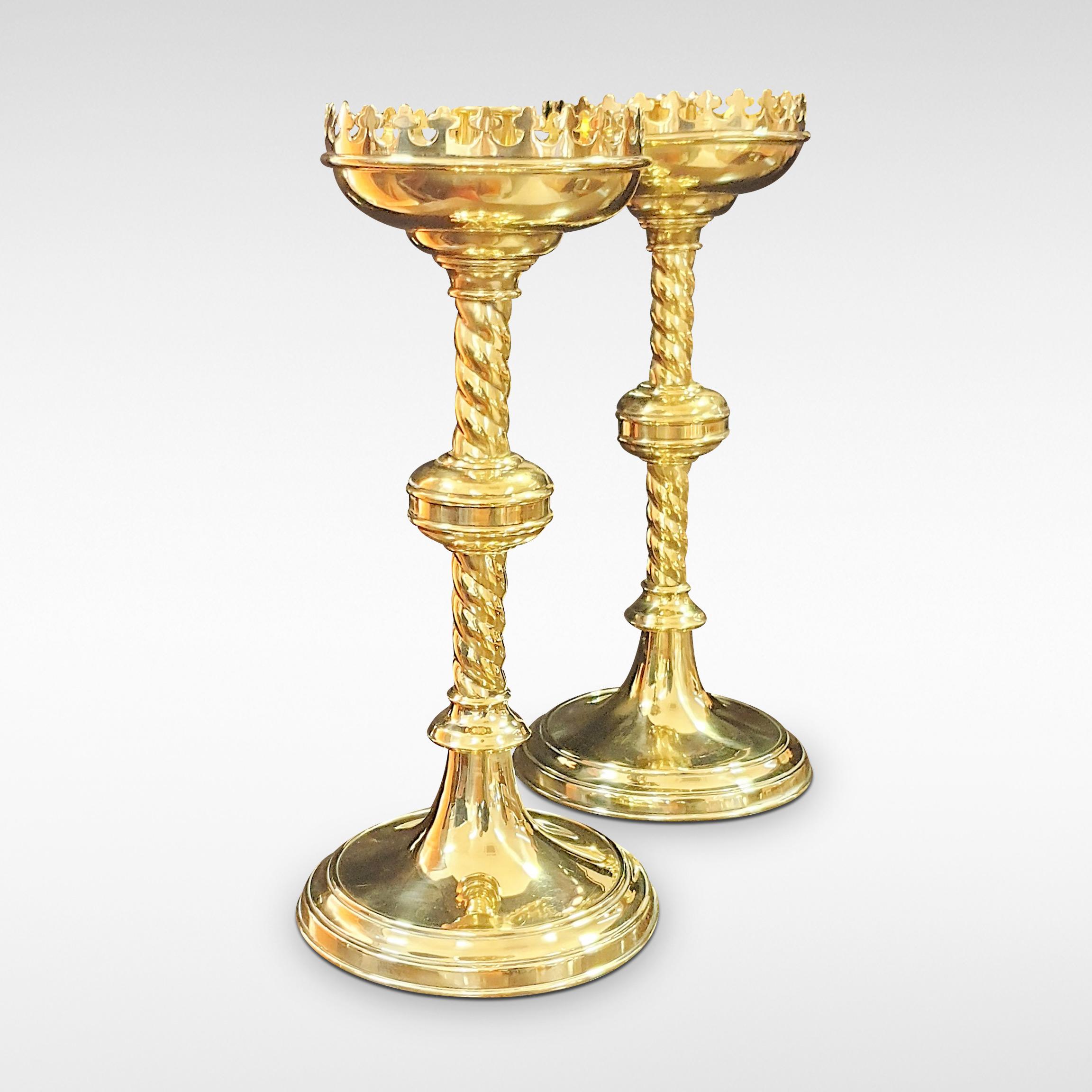 Pair of brass candlesticks, castellated sconces, late 19th century.