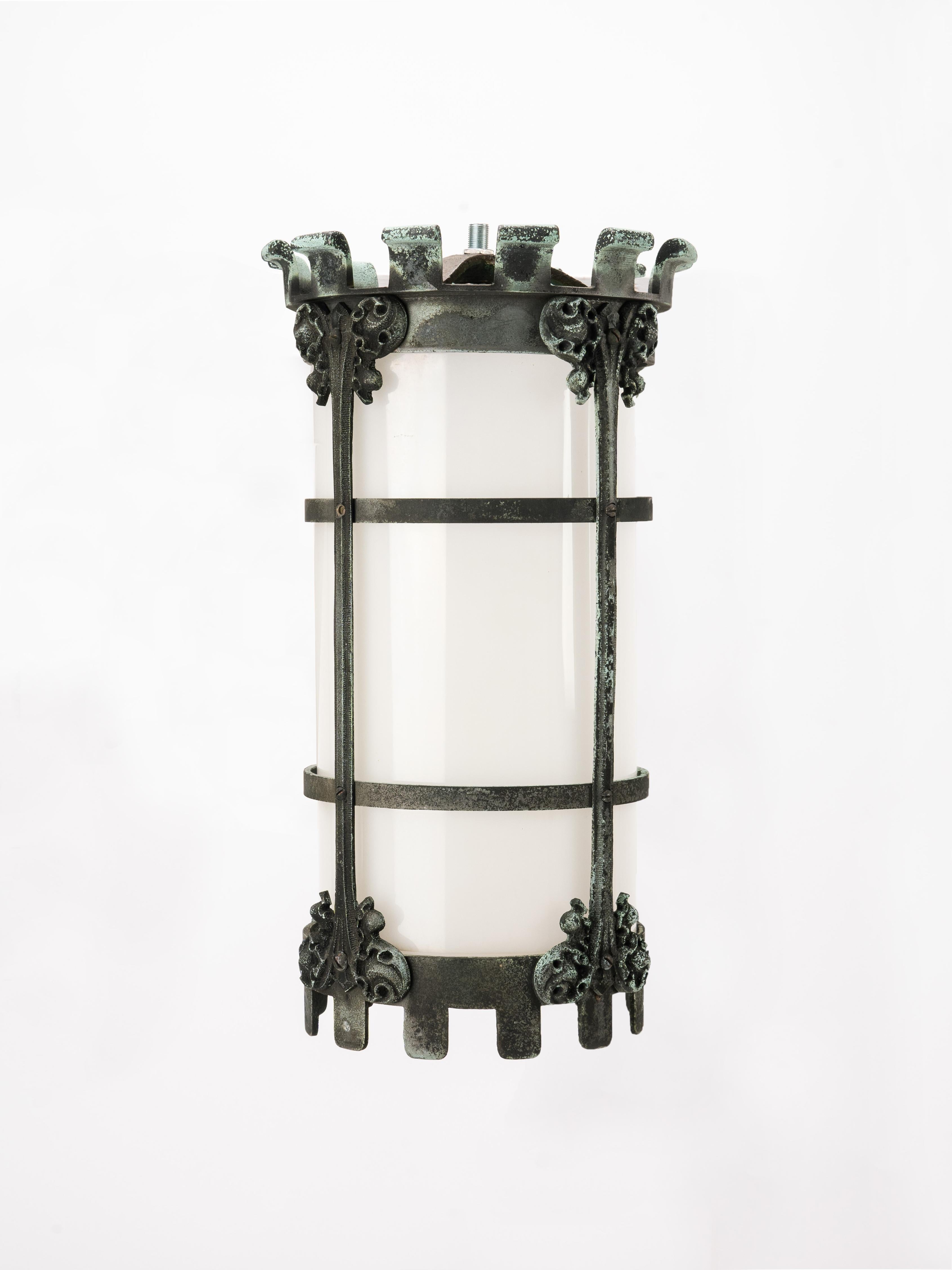 Remarkable gothic revival church light fixture. Made from beautifully patinated bronze and milk glass. Original obsolete light socket has been replaced with a new standard phenolic light socket.

Sports beautifully oxidated cast bronze, an aesthetic