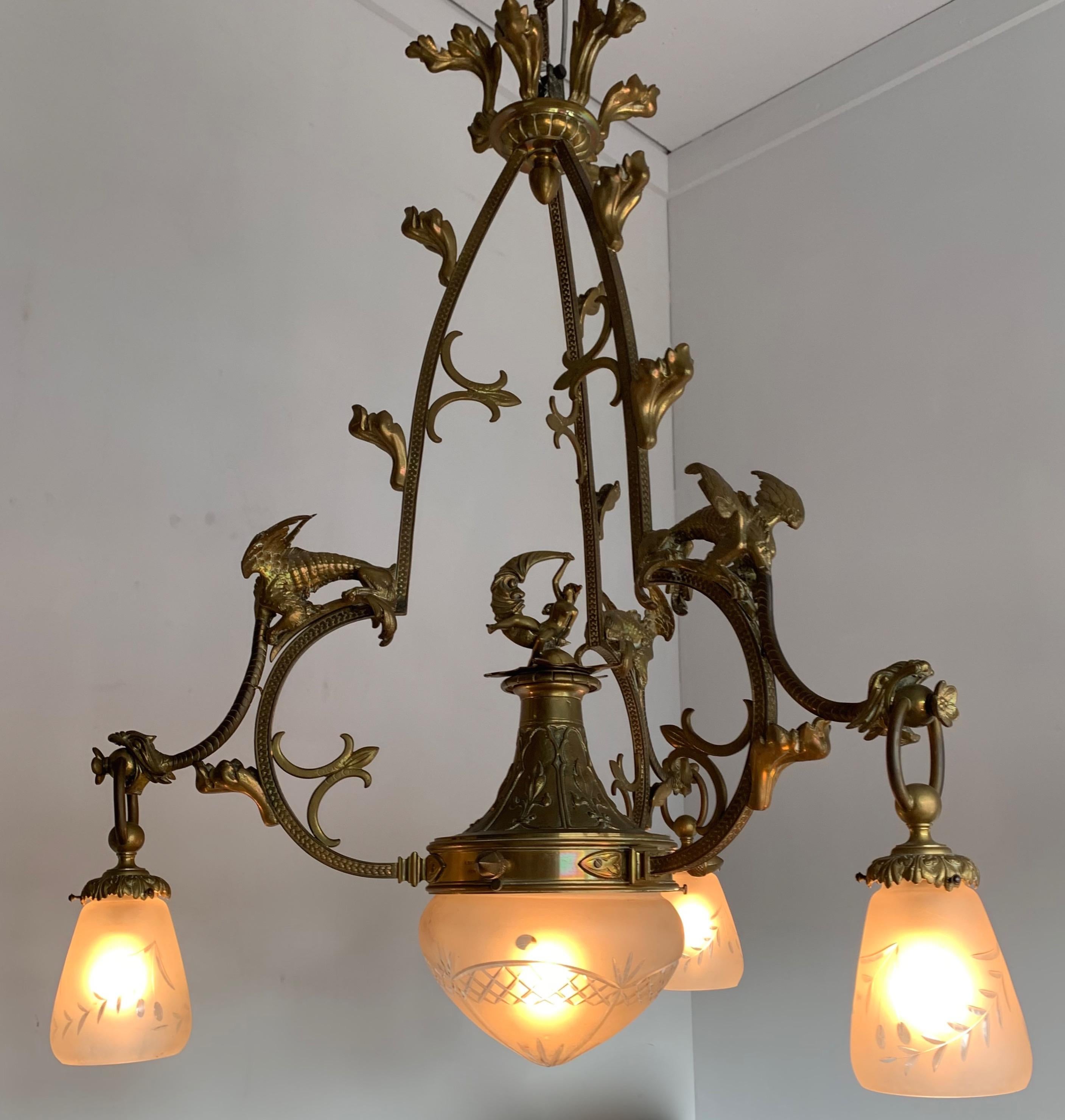 Stunning and amazingly sculptural Gothic Art chandelier.

If you are an antique collector with an eye for the extra special then this four light bronze chandelier could be right up your ally. This incredibly well made chandelier consists of three