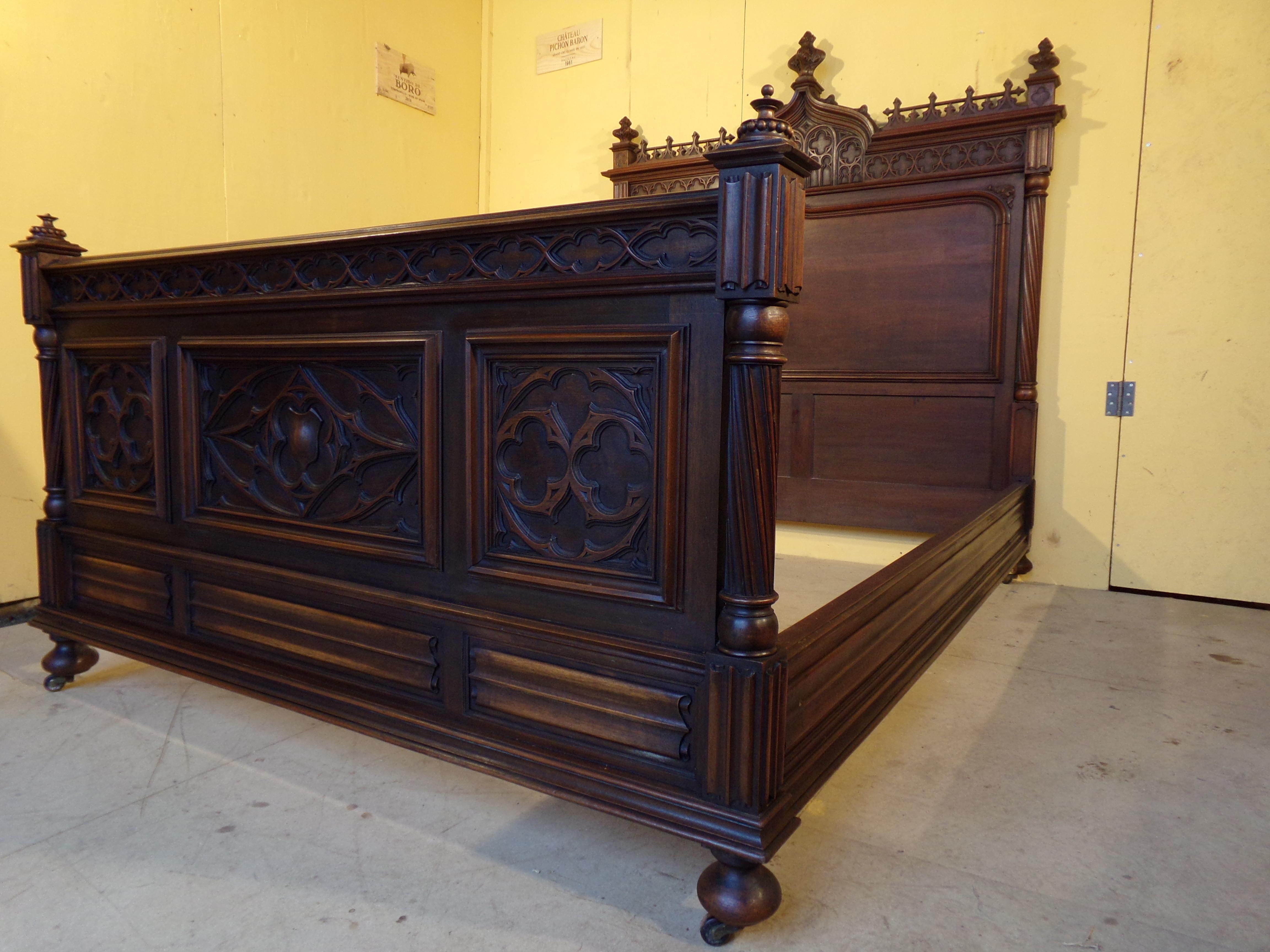 An outstanding quality hand carved walnut Gothic Revival double bed circa 1890 in superb original condition both color and cabinet work this fine bed came from a grand property near Bordeaux France where it had been in the same family for over 120