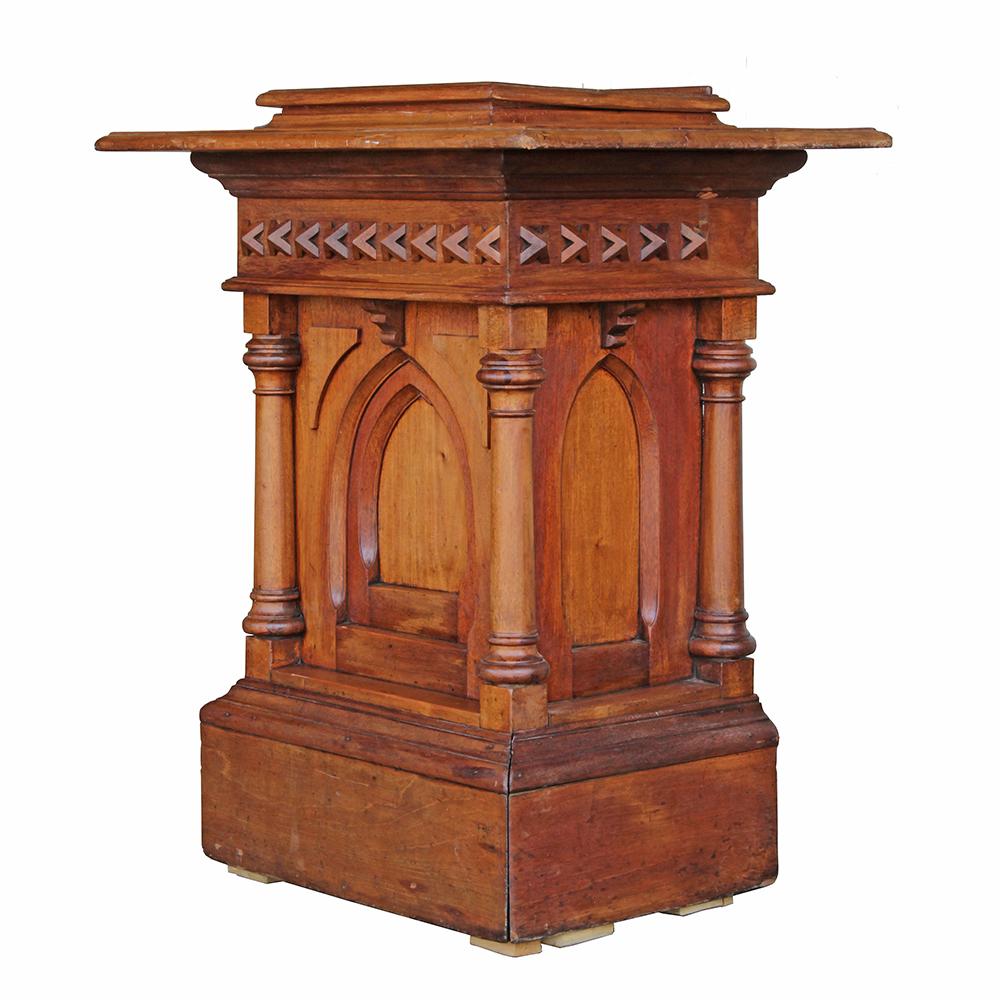 This is a beautifully executed piece of ecclesiastical furniture. Early 20th century, the Gothic Revival styling complements the warm honey hues of the solid oak construction. The carved accents are heavy but very finely executed, contributing to