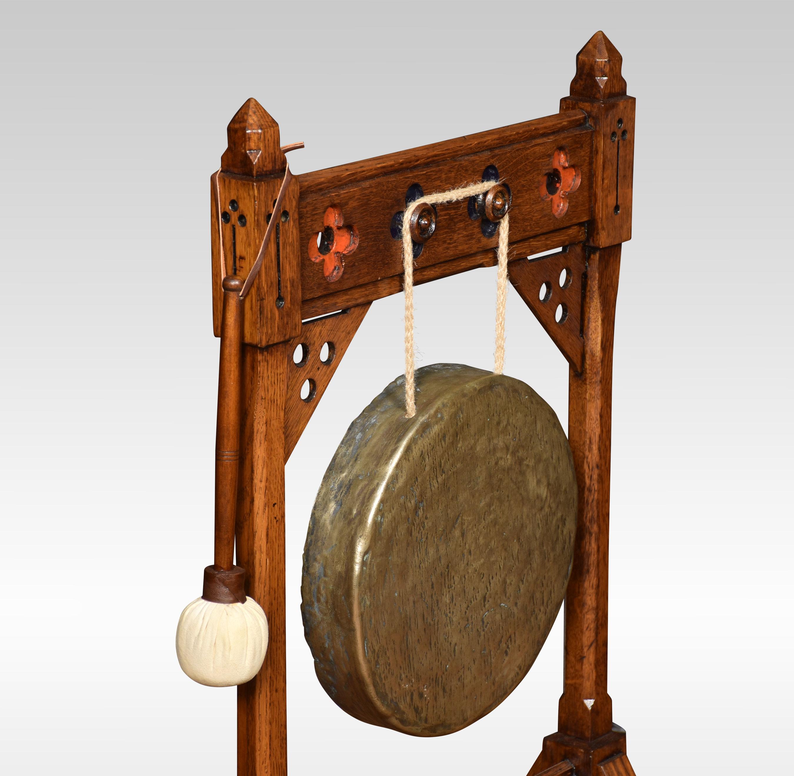 Gothic revival dinner gong, in the style of Bruce Talbert. With an oak frame, brass gong, together with beater.
Dimensions
Height 39 Inches
Width 21 Inches
Depth 15 Inches.