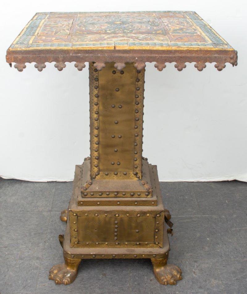 Mediterranean, possibly Spanish or Portuguese, Gothic Revival table, the tiered brass base with studded elements, the top with sheet iron metal frame inset with faience ceramic tiles hand-painted with polychrome Medieval manner geometric design,