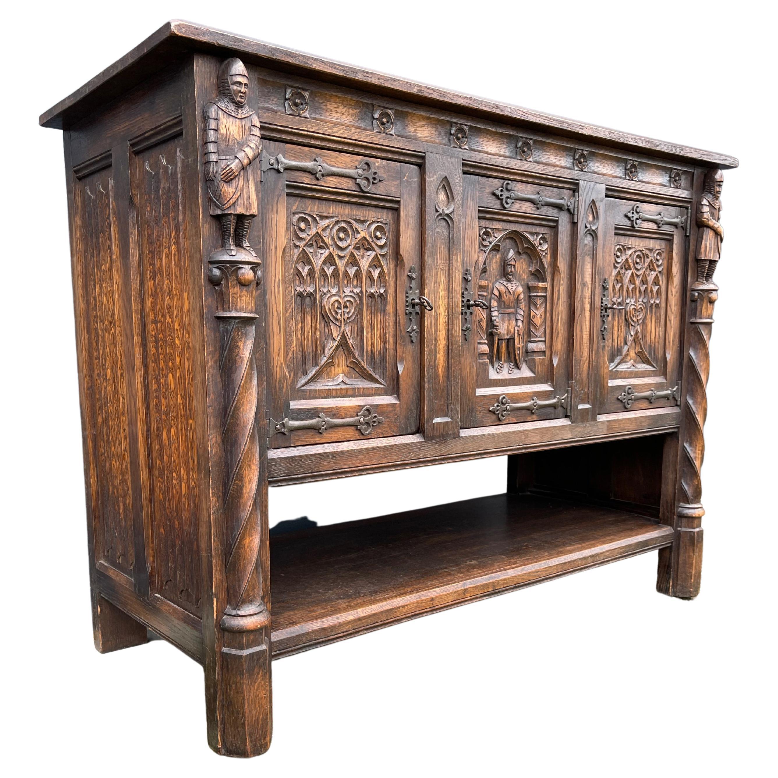 Marvelous and practical Gothic Revival drinks cabinets with knight sculptures and more.

This practical size pair, solid tiger oak credenzas or sideboards comes with three doors with six perfect working locks and six keys. These rare, Dutch Gothic