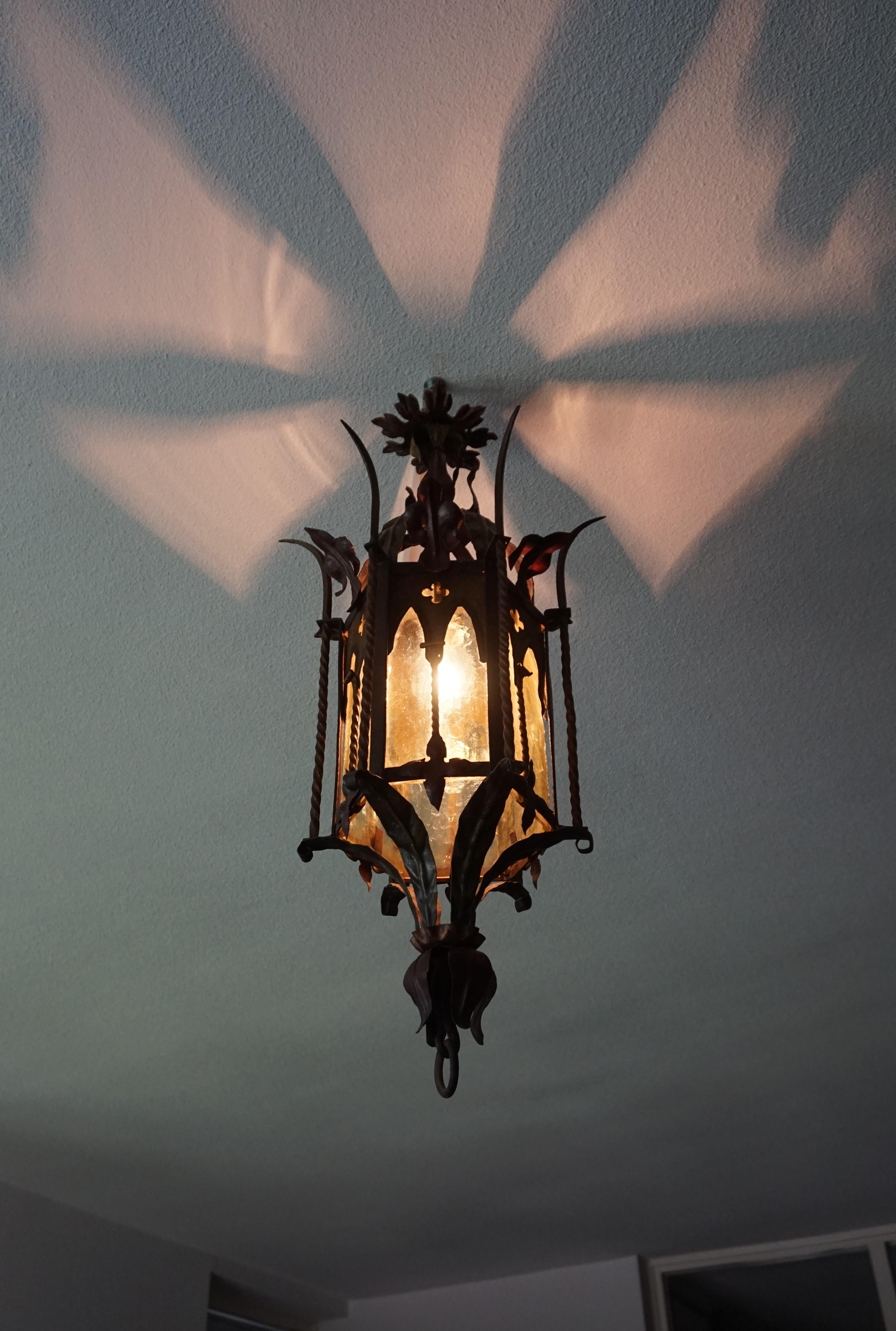 All handcrafted, hexagonal Gothic light fixture.

If you are a collector of rare and ancient looking Gothic antiques then this good size and one of a kind pendant could be flying your way soon. With antique light fixtures as one of our specialties,