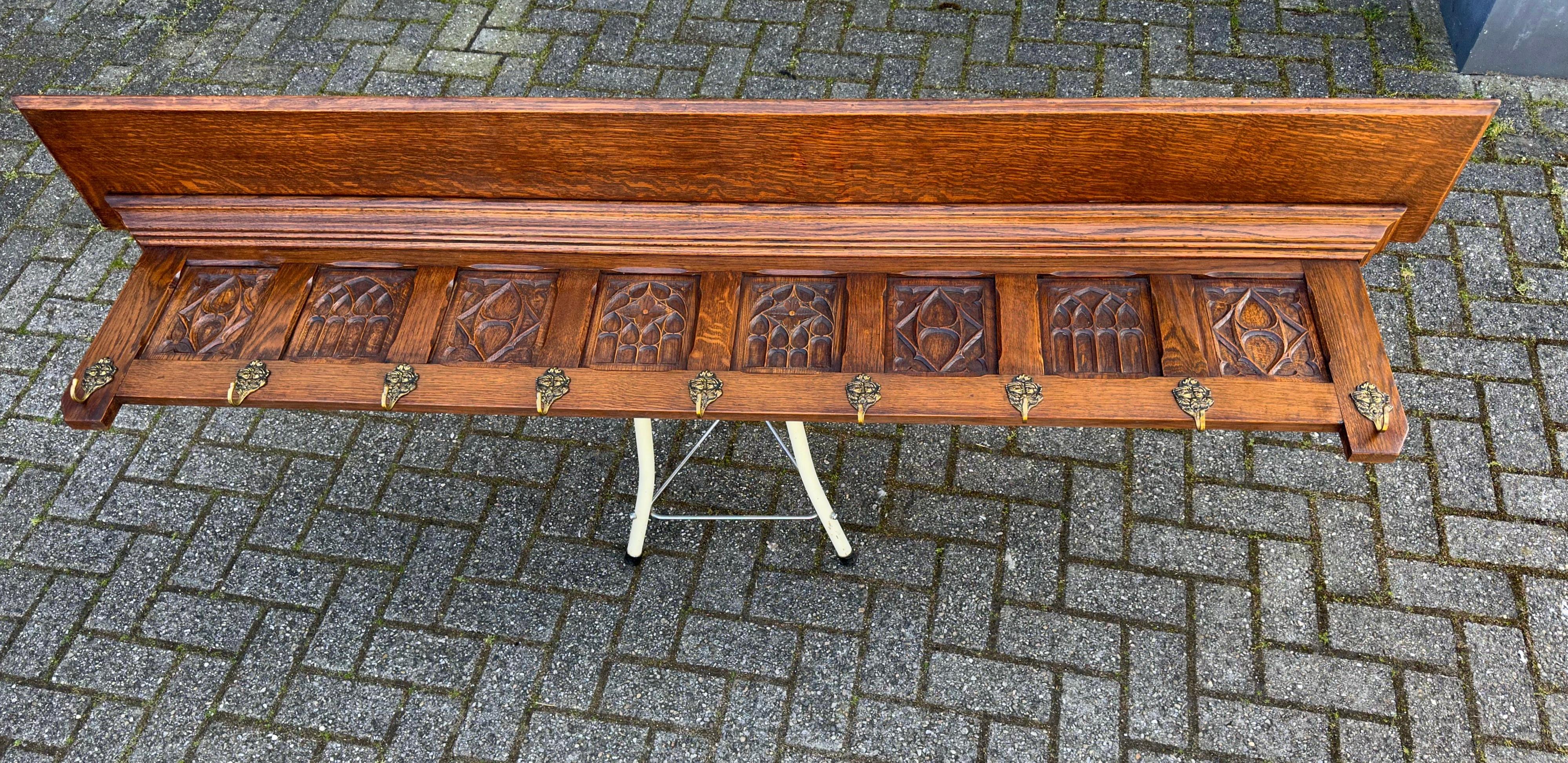 Wonderful craftsmanship, large and solid oak Gothic Revival coat-rack.

Anyone who has ever visited a Gothic (Revival) church or other Gothic style building will immediately recognize the same elements in this hand carved coat rack. The symmetry