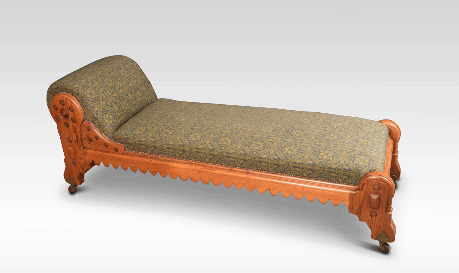 Gothic Revival chaise lounge attributed to Charles Bevan. The pitch pine frame having double column legs and carved crenellated apron all raised up on brass caps and ceramic casters.
Dimensions:
Height 31 inches, height to seat 20 inches
Width