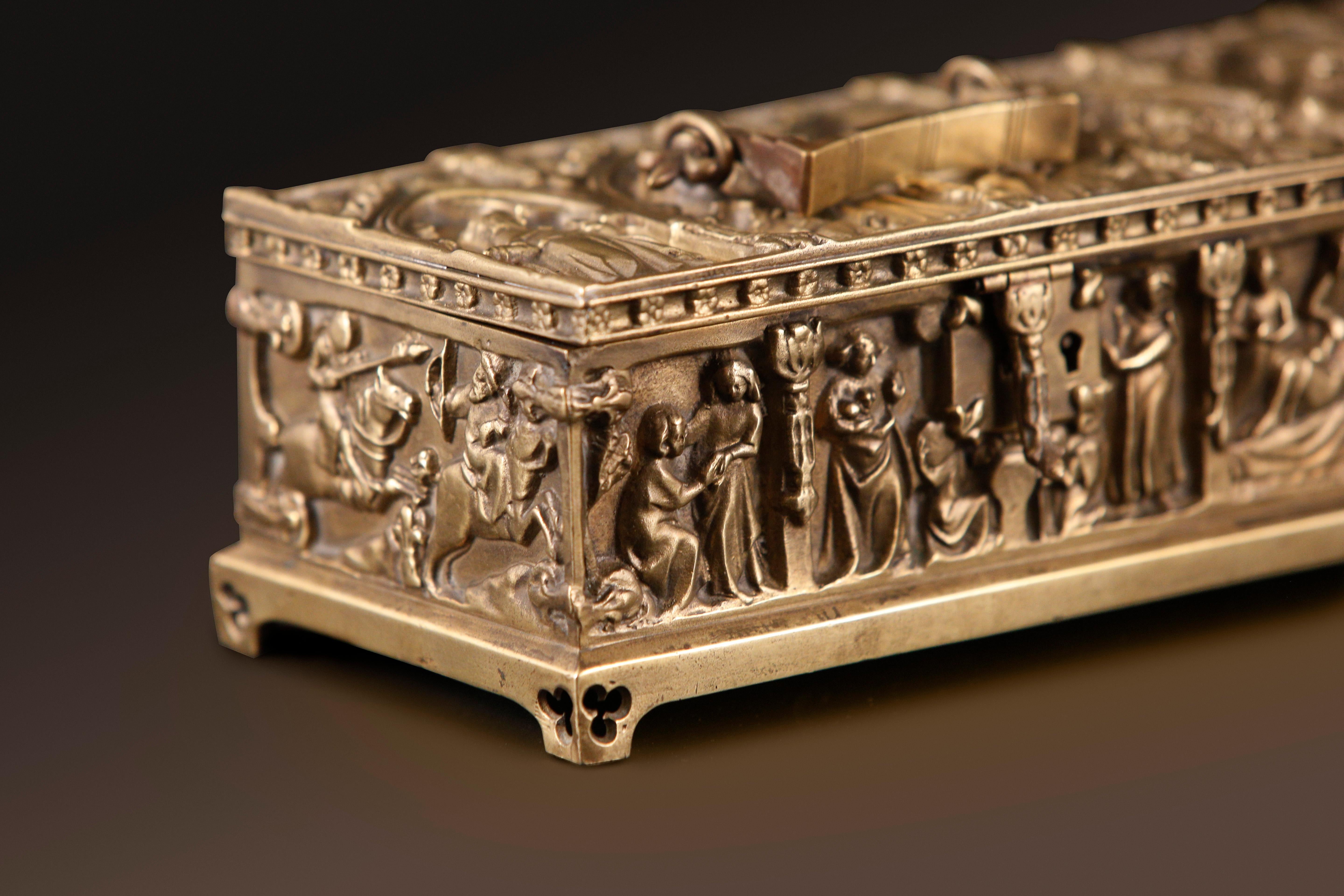 Gothic revival religious ecclesiastical bronze chest casket / jewelry box circa 1910

A finely cast solid bronze rectangular casket features stylized decorative gothic archway panel designs on all sides, showcasing intricate rural medieval scenes.