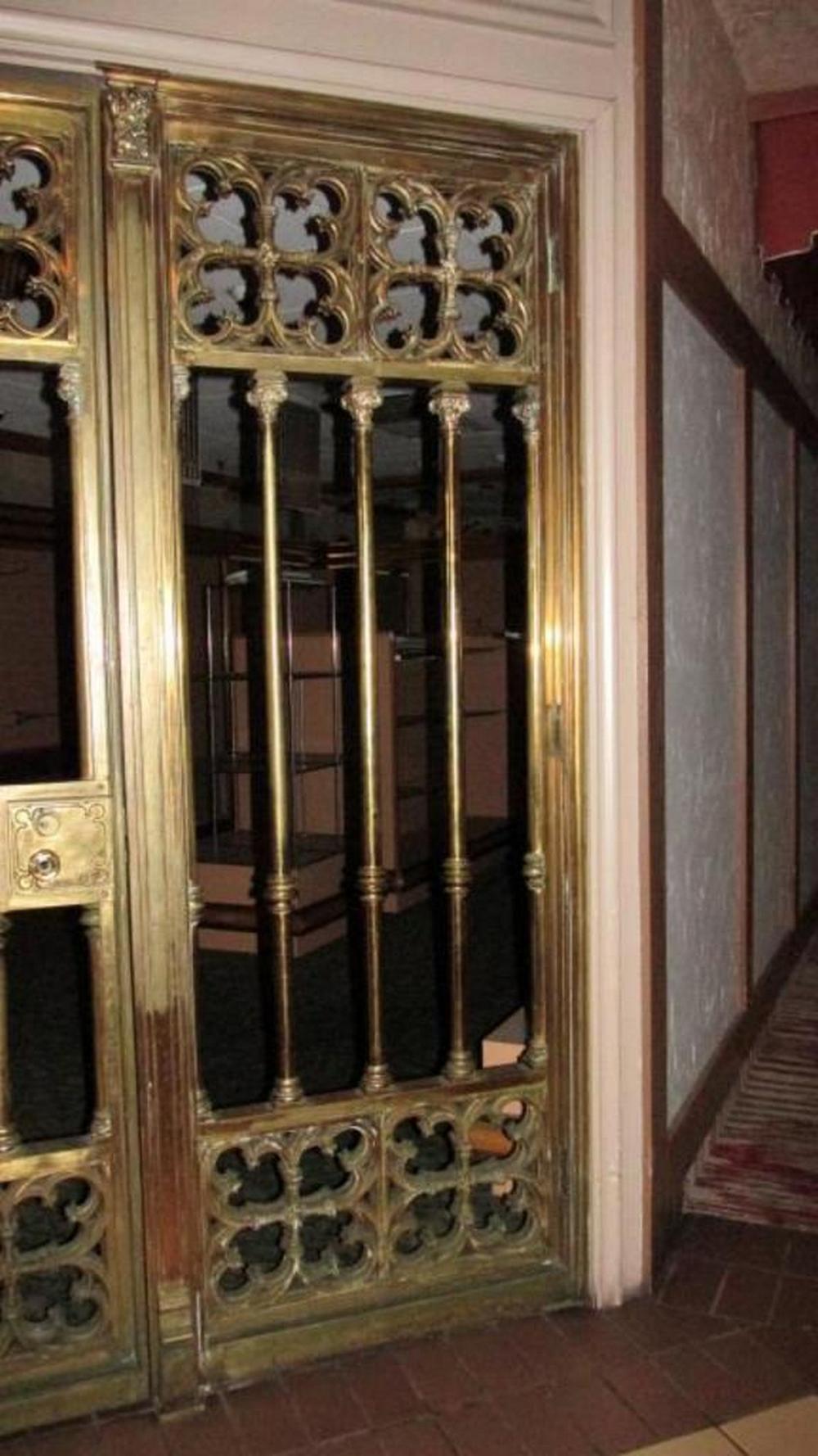 Turn of the century, Gothic Revival, three-piece heavy cast bronze bank gate storefront is very ornate, extremely heavy, locking but lock is not present. Removed from Ohio Citizens Bank in Downtown Toledo, entrance to vault. Wear as expected with