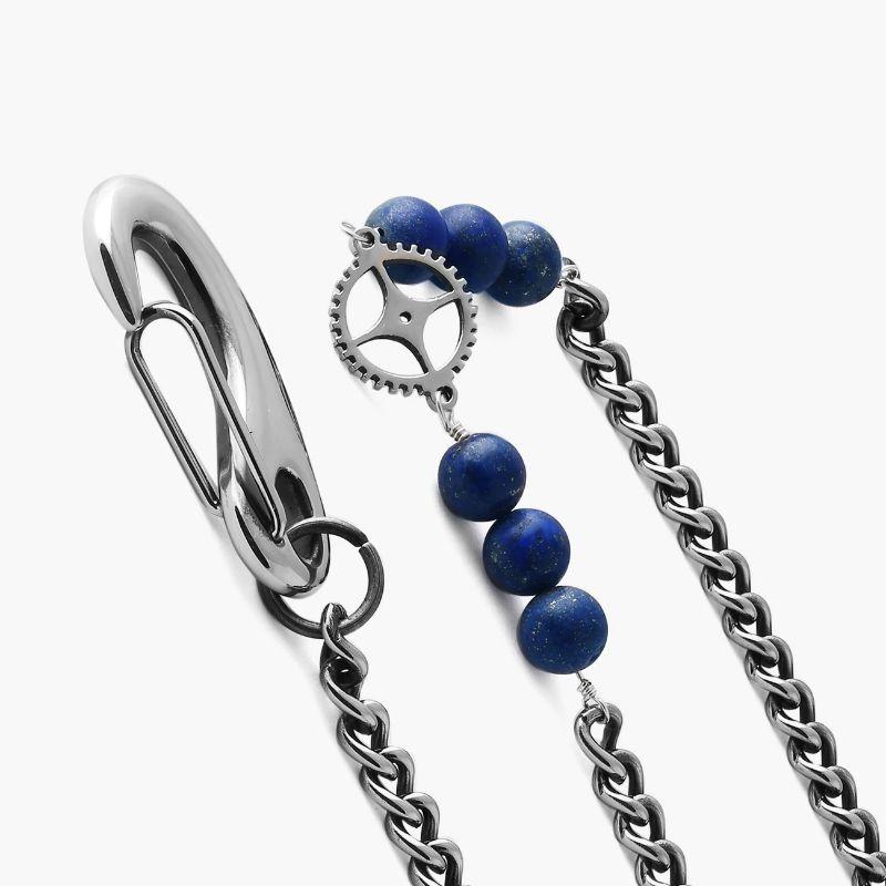 Gothic Rose Skull trouser chain in blue

These unique and eye-catching trouser chains are inspired by the Grateful Dead band and include their iconic skull with a rose crown with red and blue enamel detail. They also feature the signature Tateossian