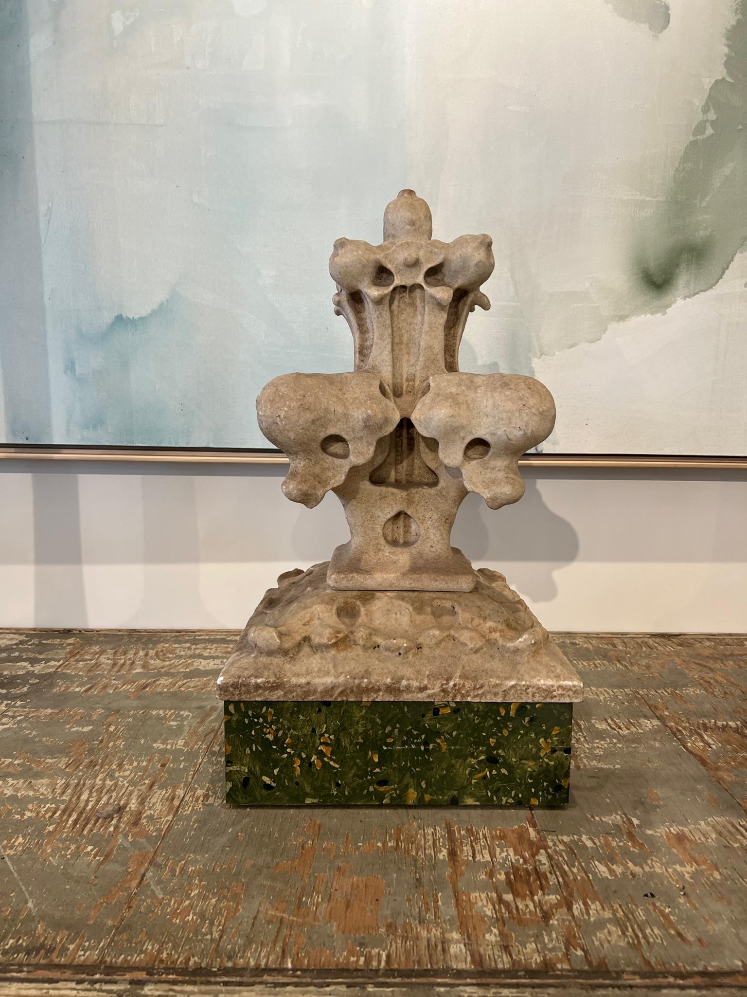 Decorative stone finial in extraordinarily good condition. It is in two pieces which are stacked on a contemporary base. This is the kind of objet d'art that could be combined in a tabletop grouping of singularly.