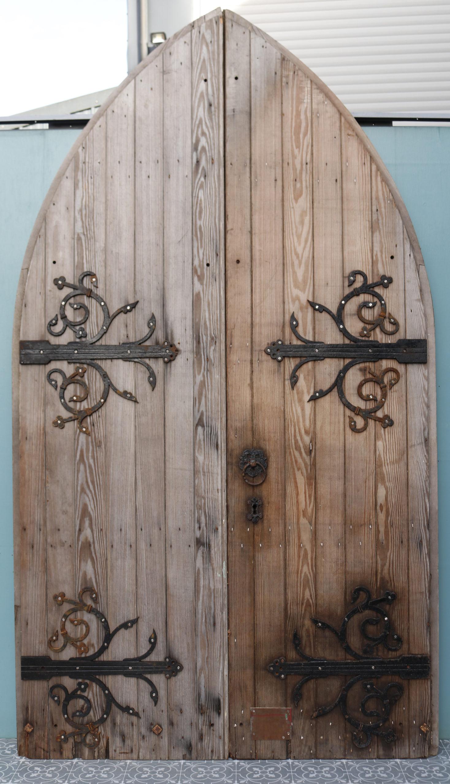 A pair of arched exterior pine doors salvaged from a church in Cambridgeshire.