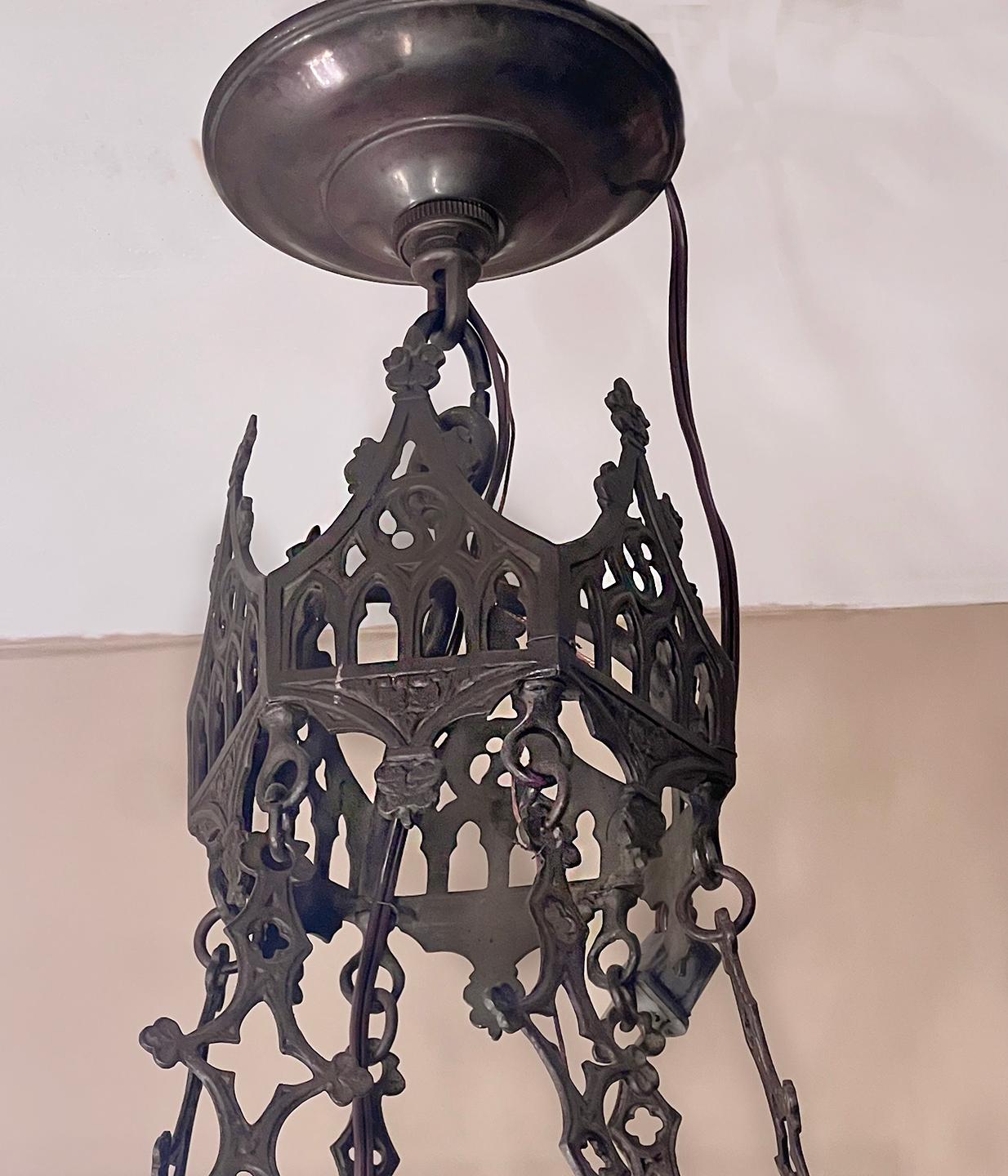 A circa 1900 Italian bronze Gothic-style chandelier with original patina.

Measurements:
Minimum Drop: 55