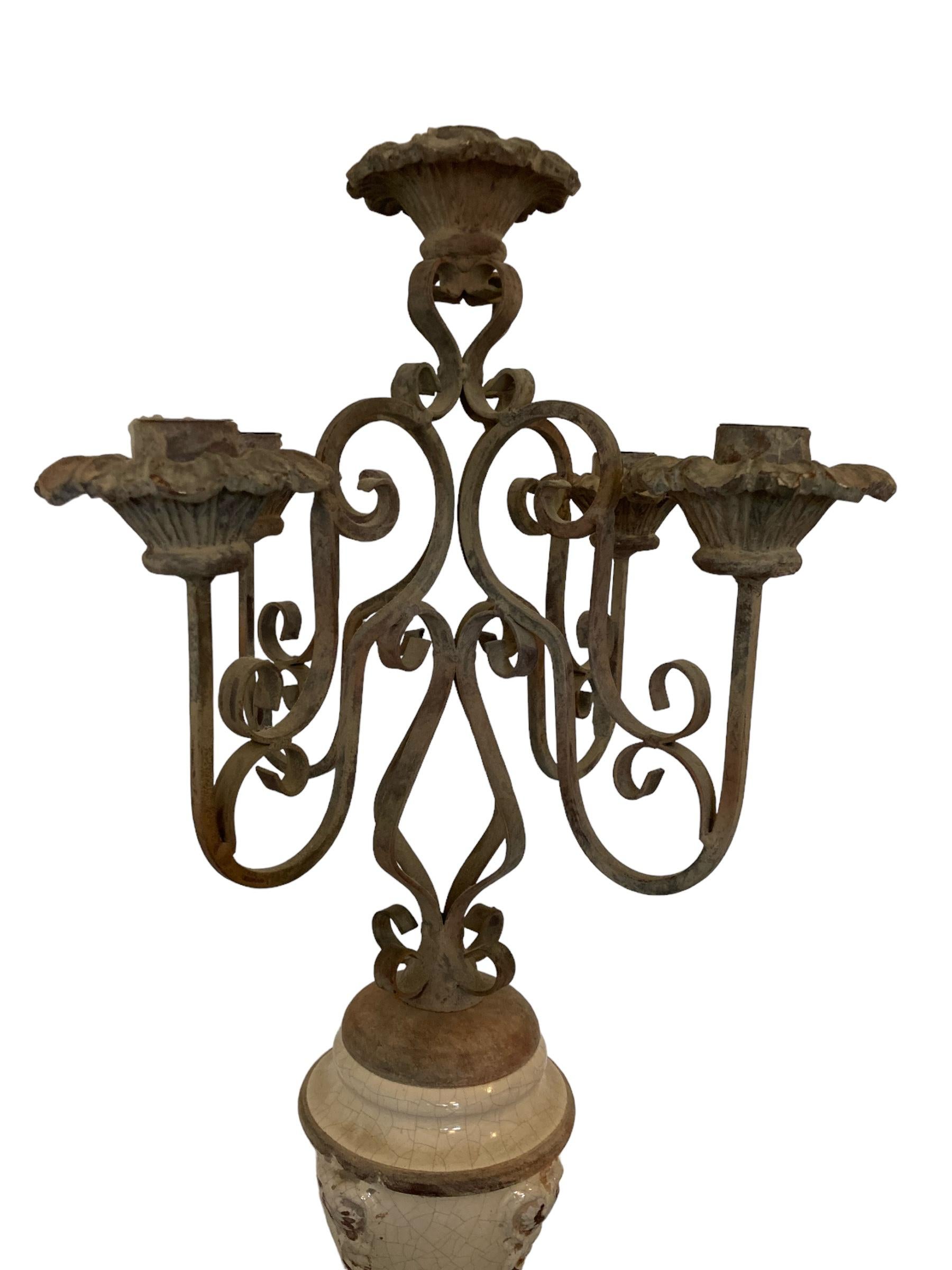 Gothic Style Five candle candelabra wrought iron with ceramic base from Germany.
This elegant candelabra features a beautifully designed ceramic base that adds a touch of sophistication to any room. Crafted with attention to detail, this decorative