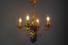 Gothic Style Gilt Wrought Iron and Black Wood Four-Light Chandelier
