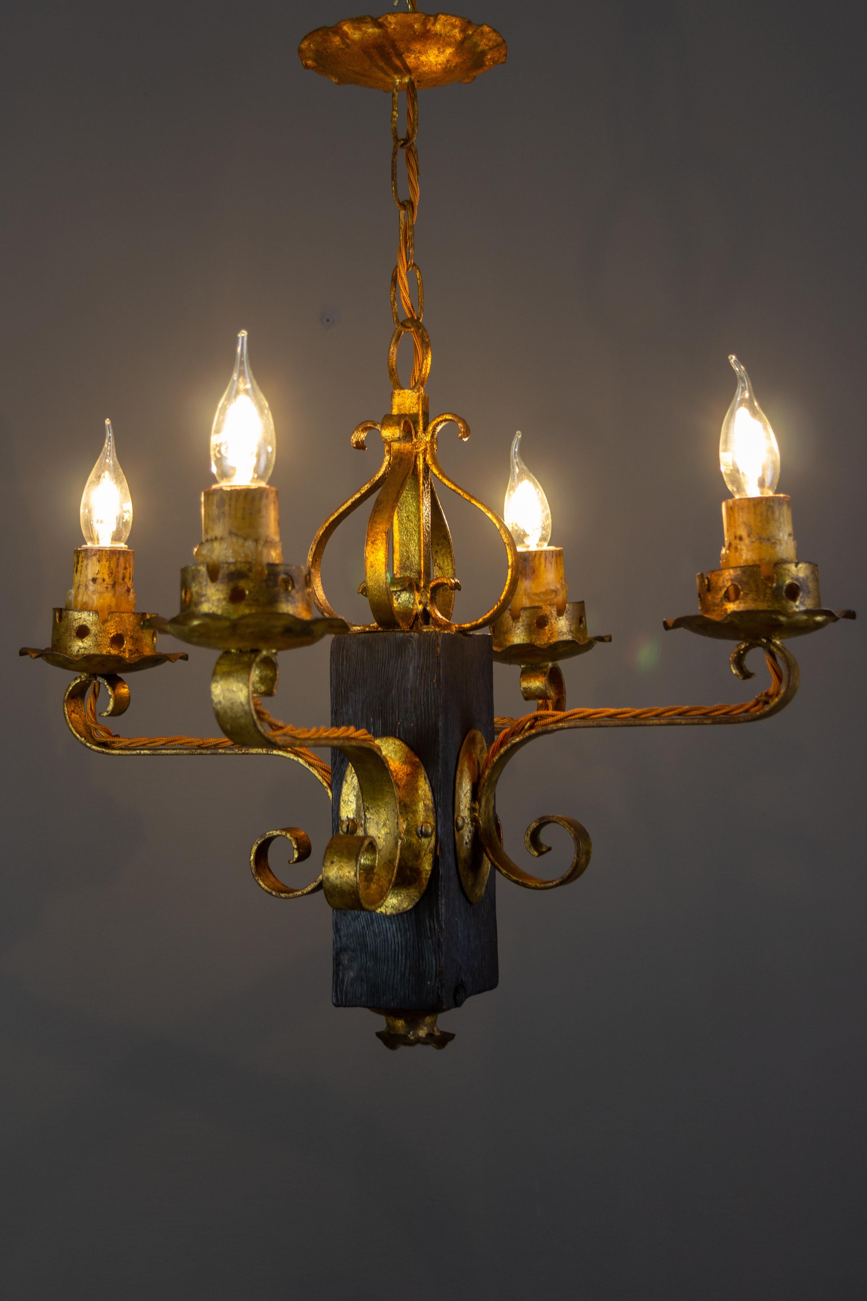 Gothic Style Gilt Wrought Iron and Black Wood Four-Light Chandelier For Sale 11