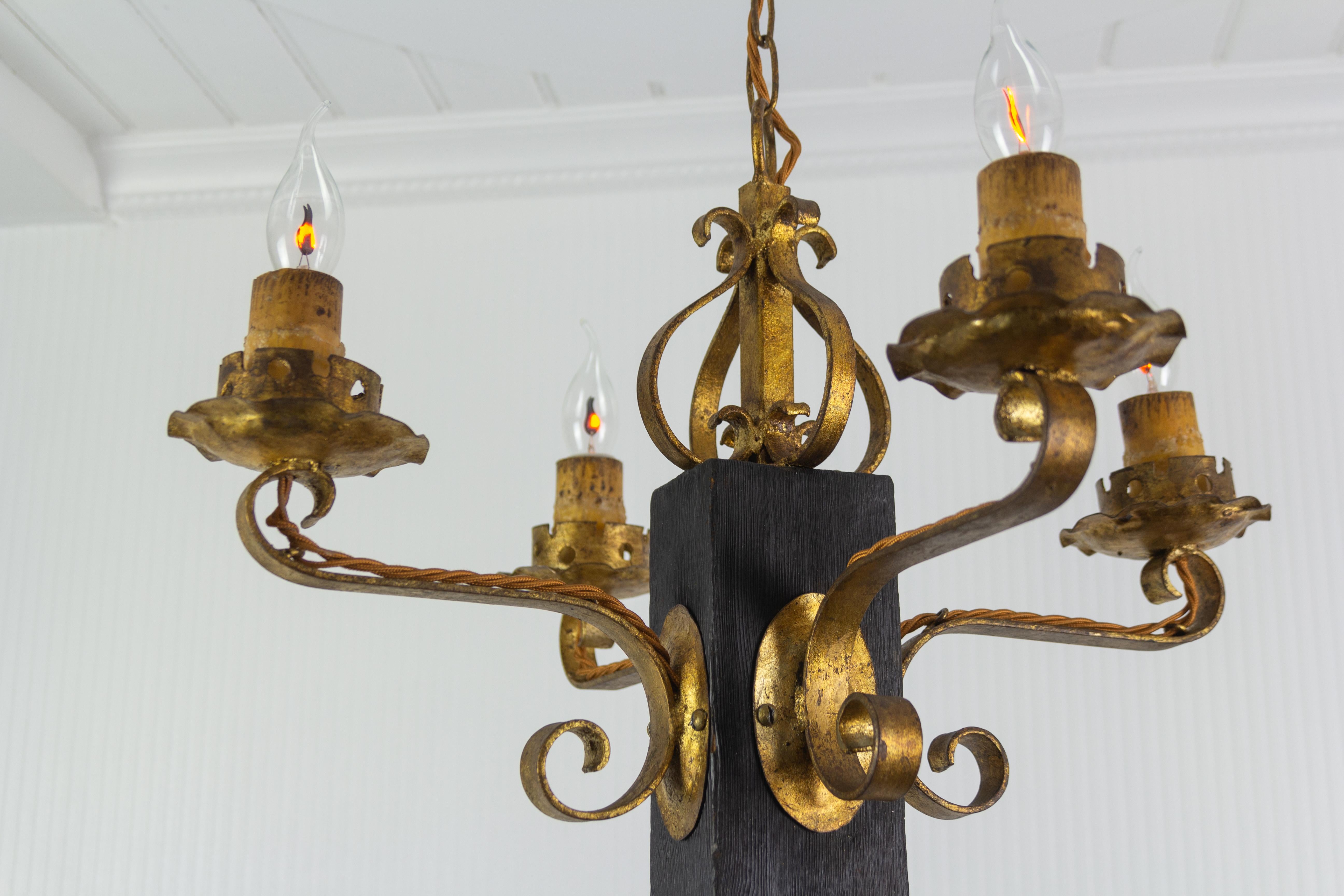 Gothic Revival Gothic Style Gilt Wrought Iron and Black Wood Four-Light Chandelier For Sale