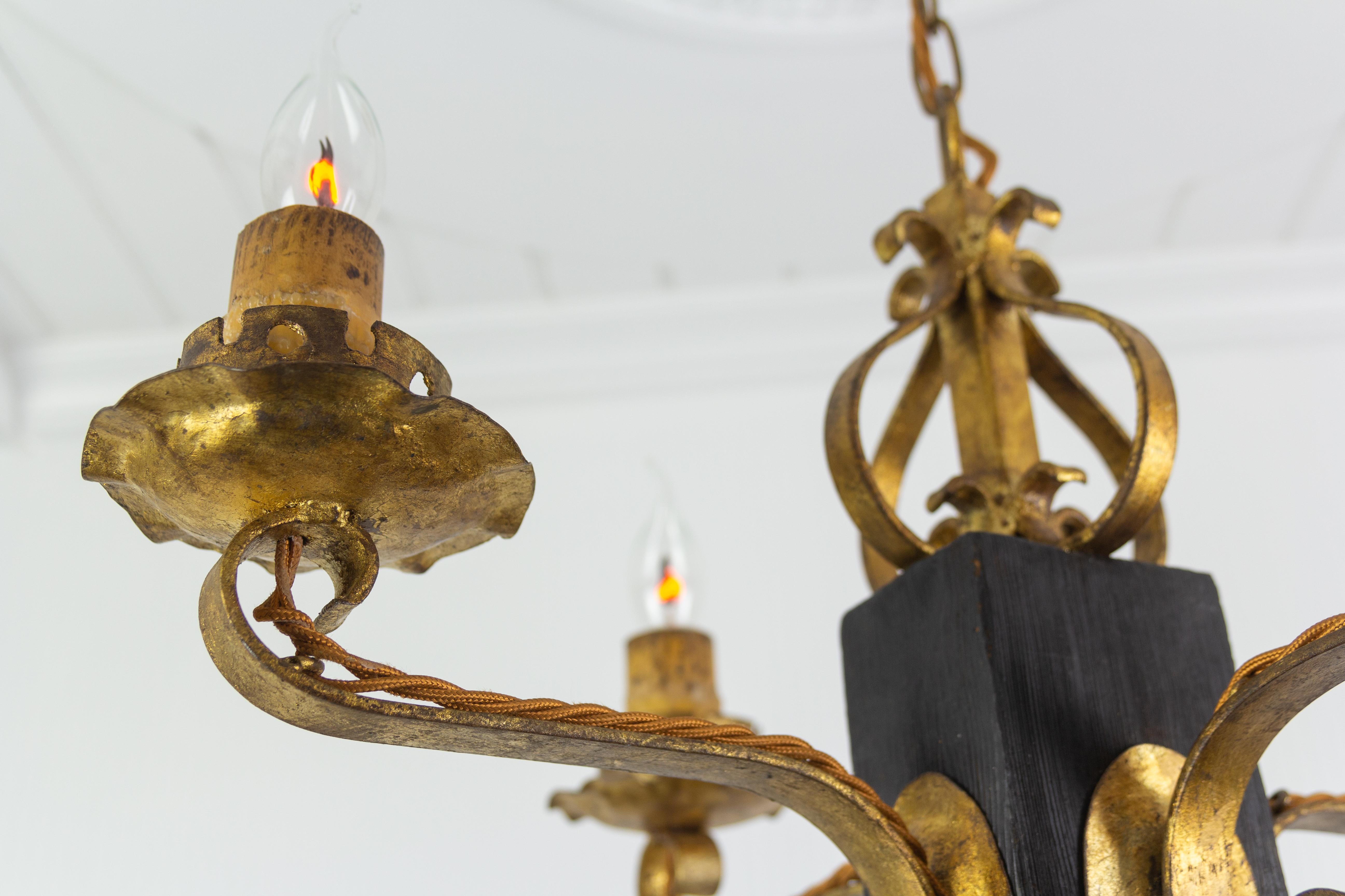 Spanish Gothic Style Gilt Wrought Iron and Black Wood Four-Light Chandelier For Sale
