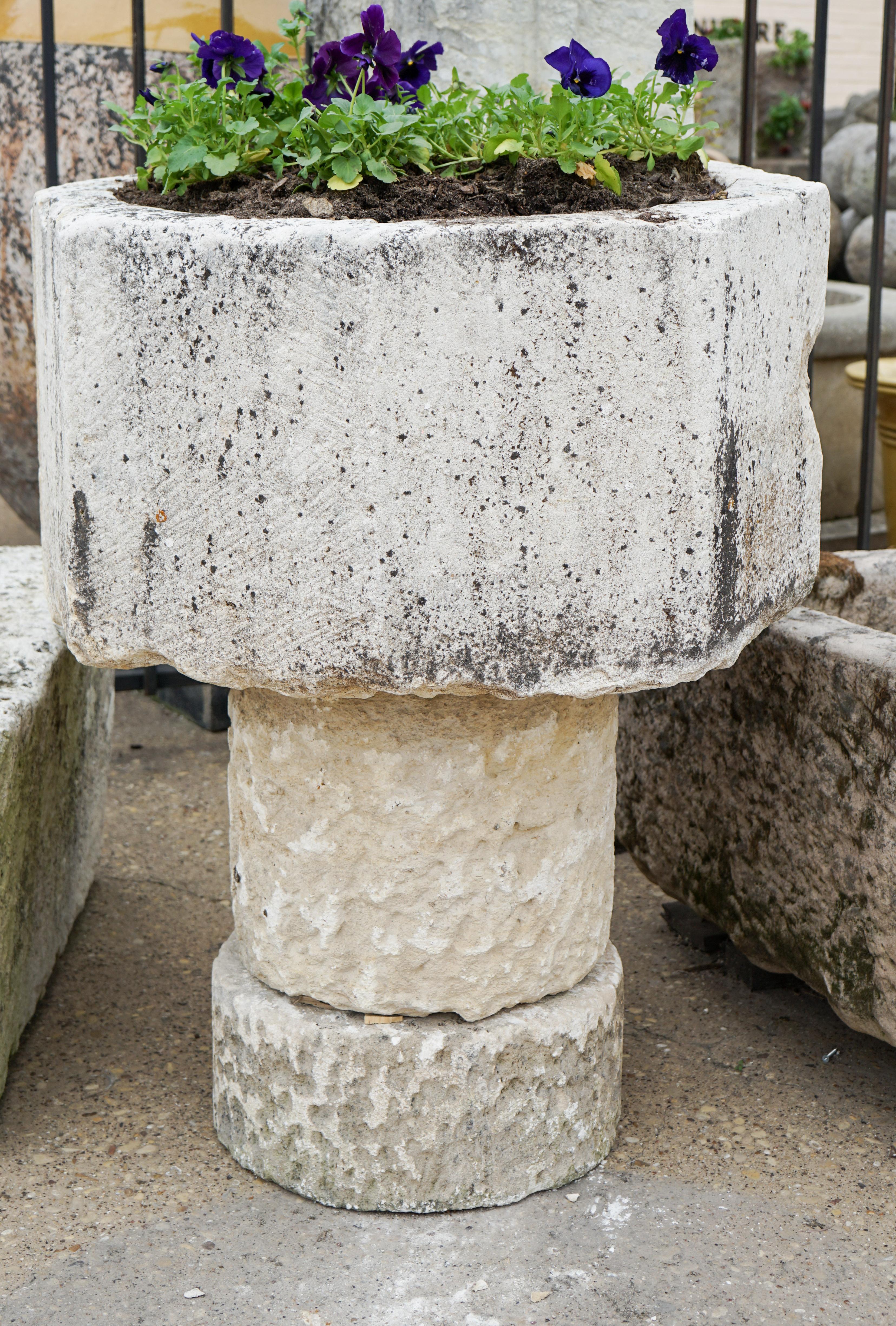 This rough-hewn limestone octagonal basin has been repurposed for outdoor use and sits on a newer two part stone base. Sourced from the Loire Valley, France, circa 18th century.

Basin measures 33 inches in diameter and 17 inches deep, with the