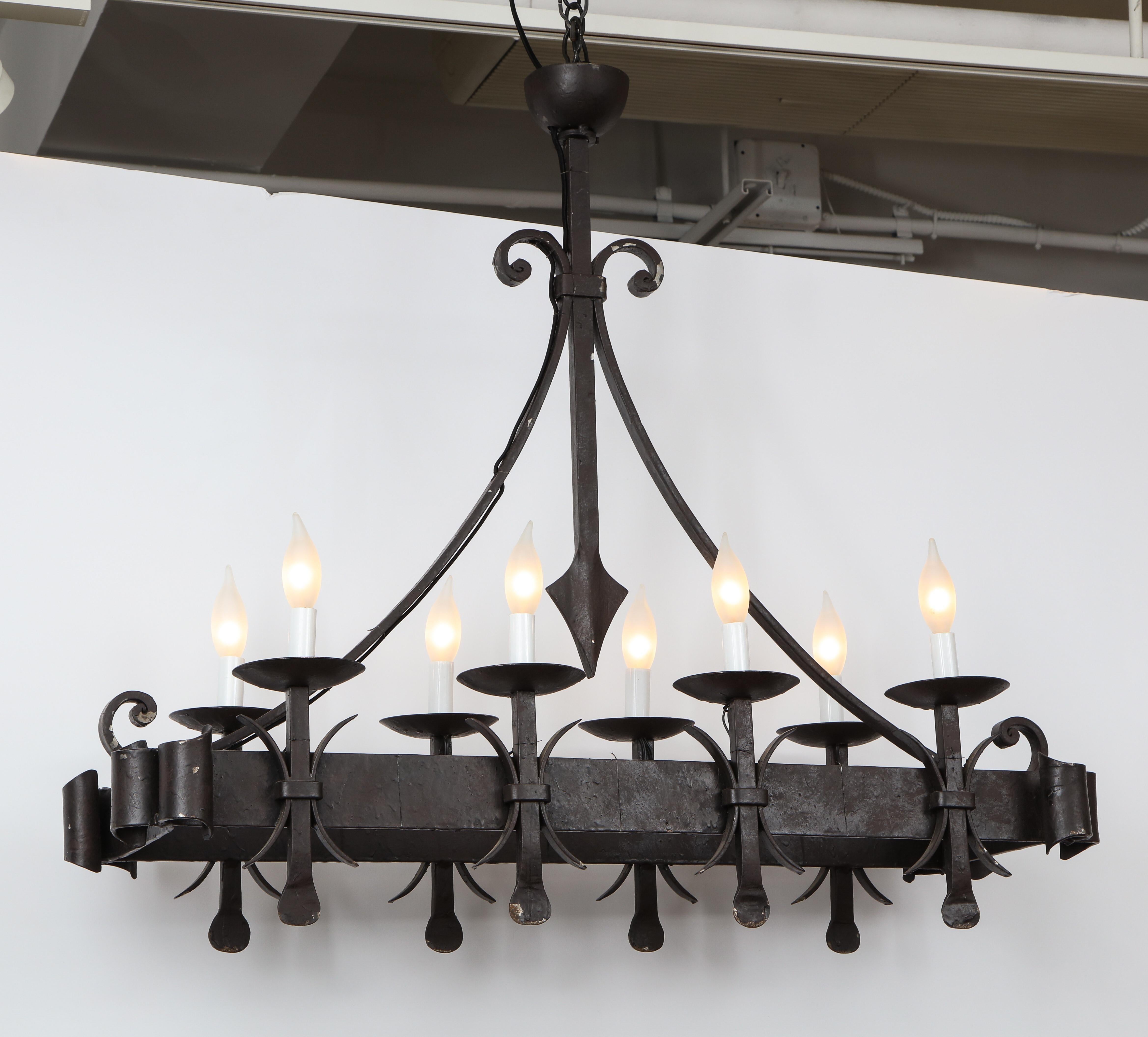 Black painted wrought iron rectangular chandelier with 8 lights.