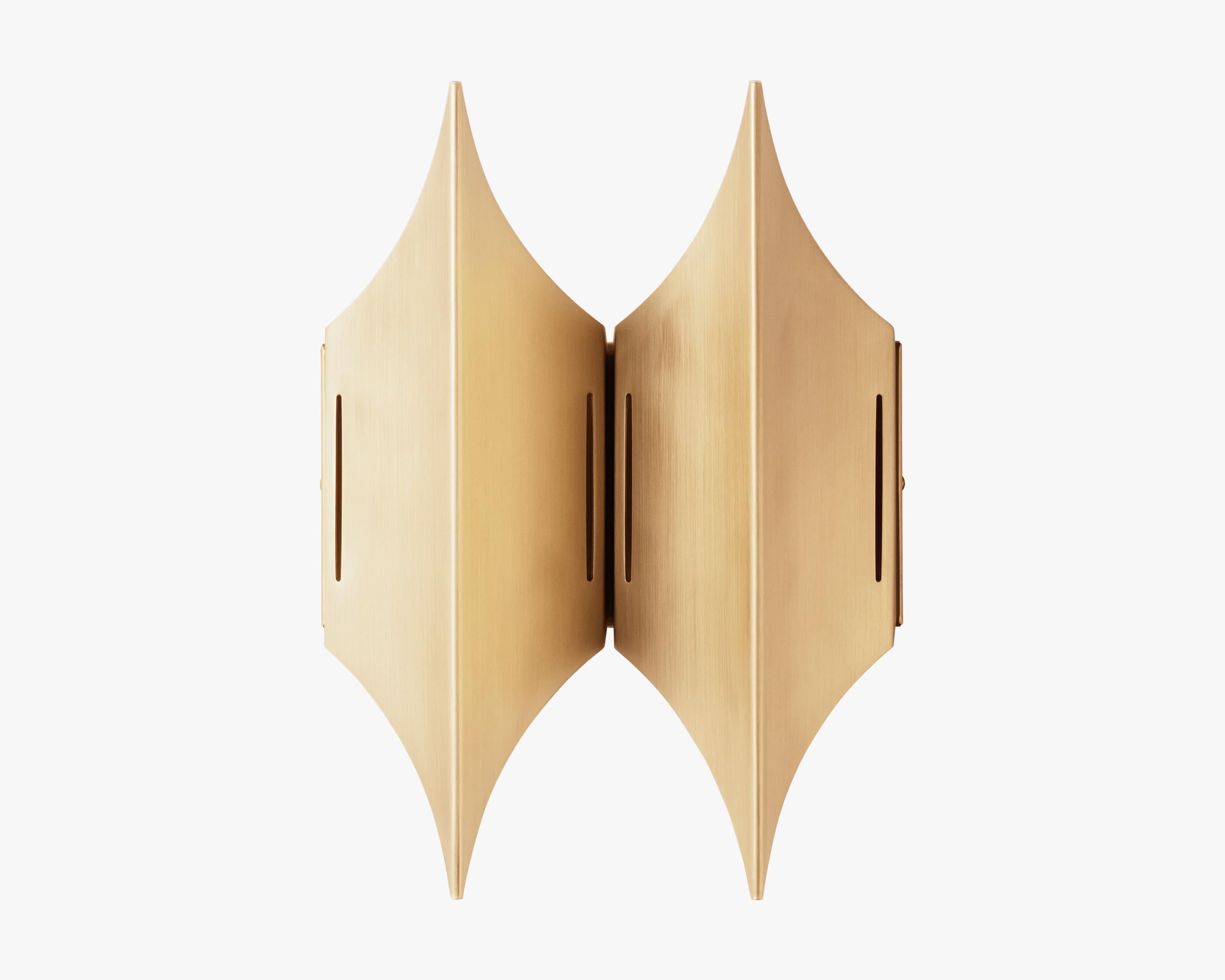WALL LAMP GOTHIC II BY LYFA
Wall lamp Gothic II signed by Bent Karlby for LYFA

Brushed brass
L.206 mm H.280 mm
Bulbs: 2 x G9 max 28W (110V-230V)

--
GOTHIC I is a distinctive wall lamp full of character designed in 1970 by Bent Karlby. The