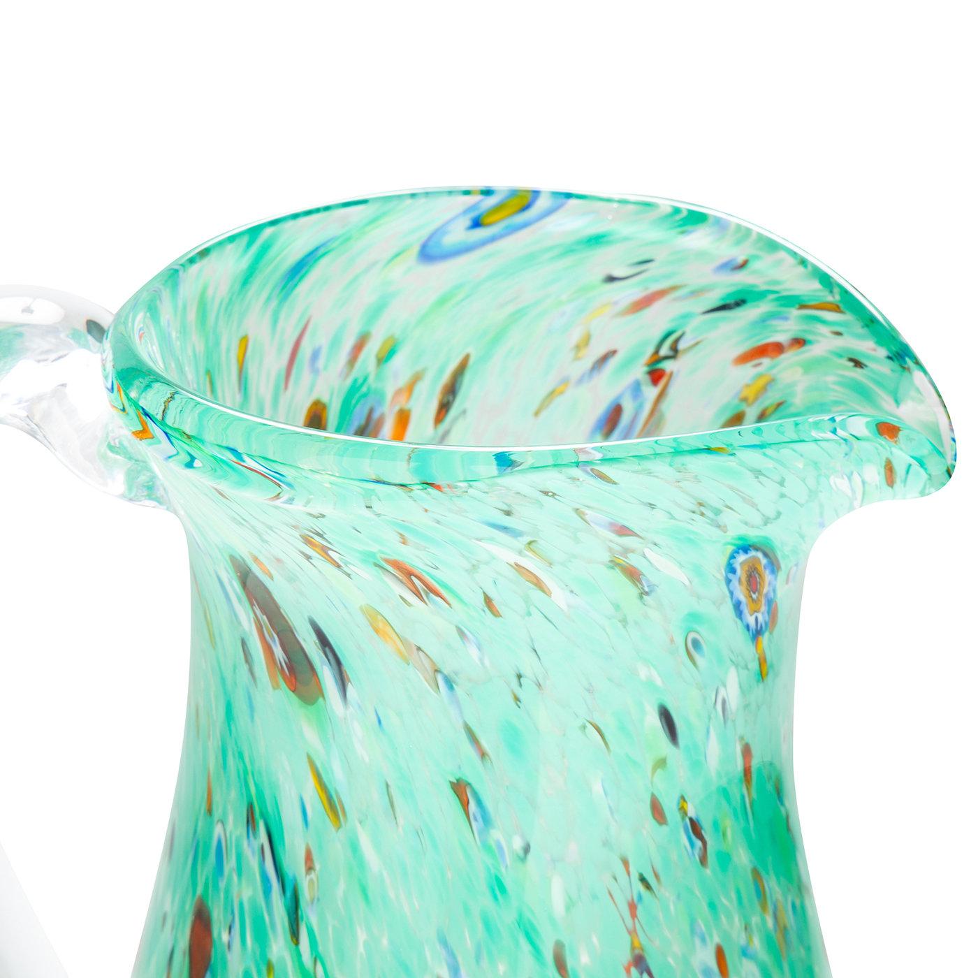 To stay hydrated in front of roaring furnaces, Venetian glass masters would craft personalized drinking glasses of their own styling. Getting its name from the Venetian word for cup - goto - the GO.TO Sea Green Pitcher is a nod to this tradition,