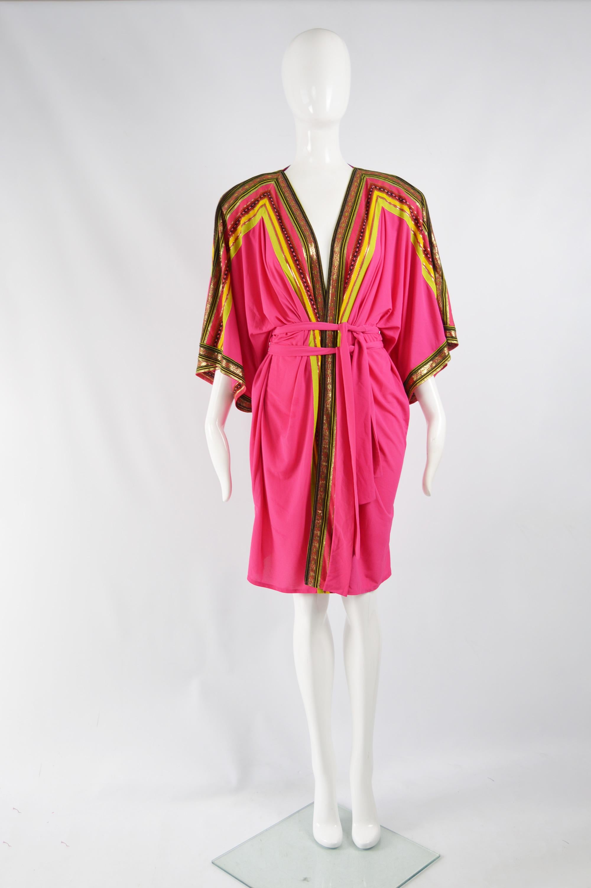 A beautiful vintage womens kimono inspired robe / jacket from the 80s by luxury Israeli brand Gottex, for the iconic British department store, Harrods. In a pink jersey with yellow and gold brocade trimming the edges. It has shoulder pads and two