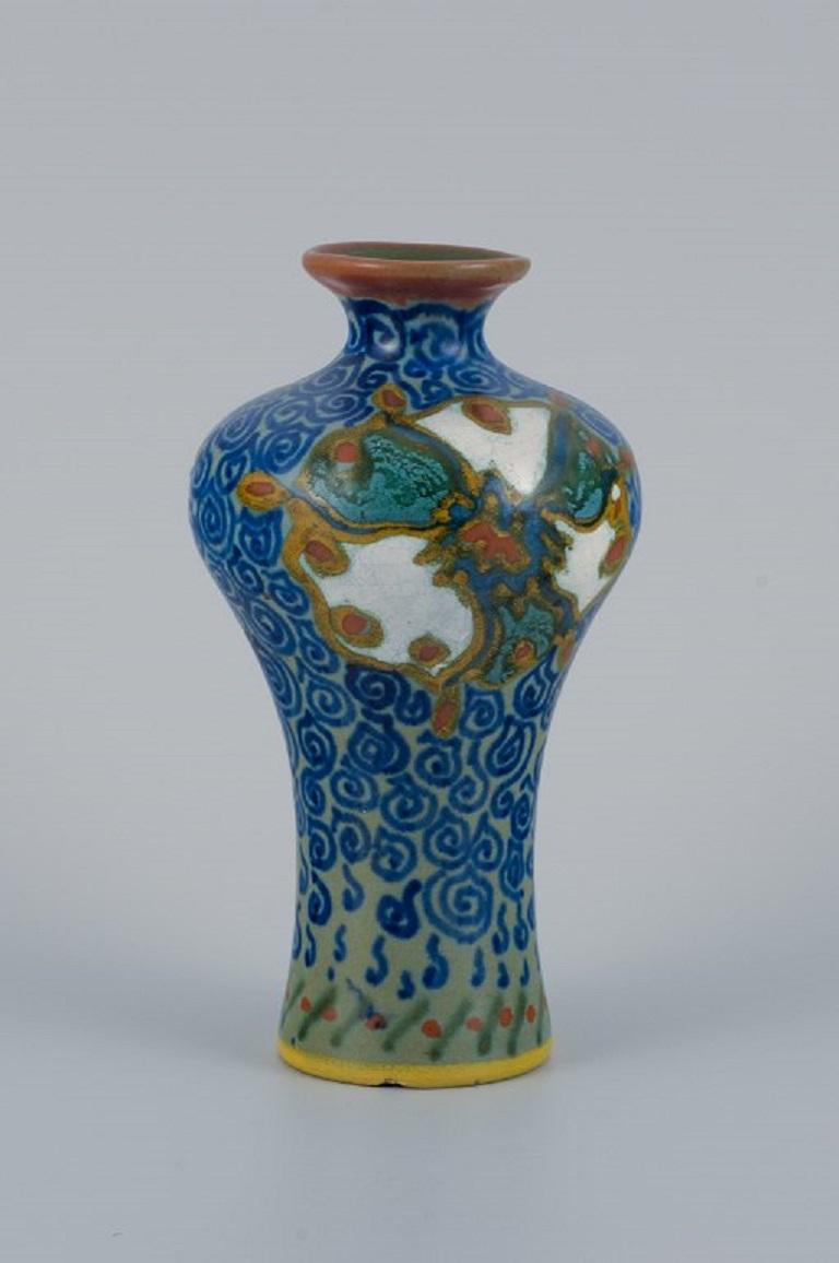 Gouda, Netherlands. Art Nouveau hand-decorated ceramic vase.
Approx. 1920s.
Marked
In good condition, small insignificant chip at the base of the vase.
Dimensions: H 14.5 x D 8.0 cm.