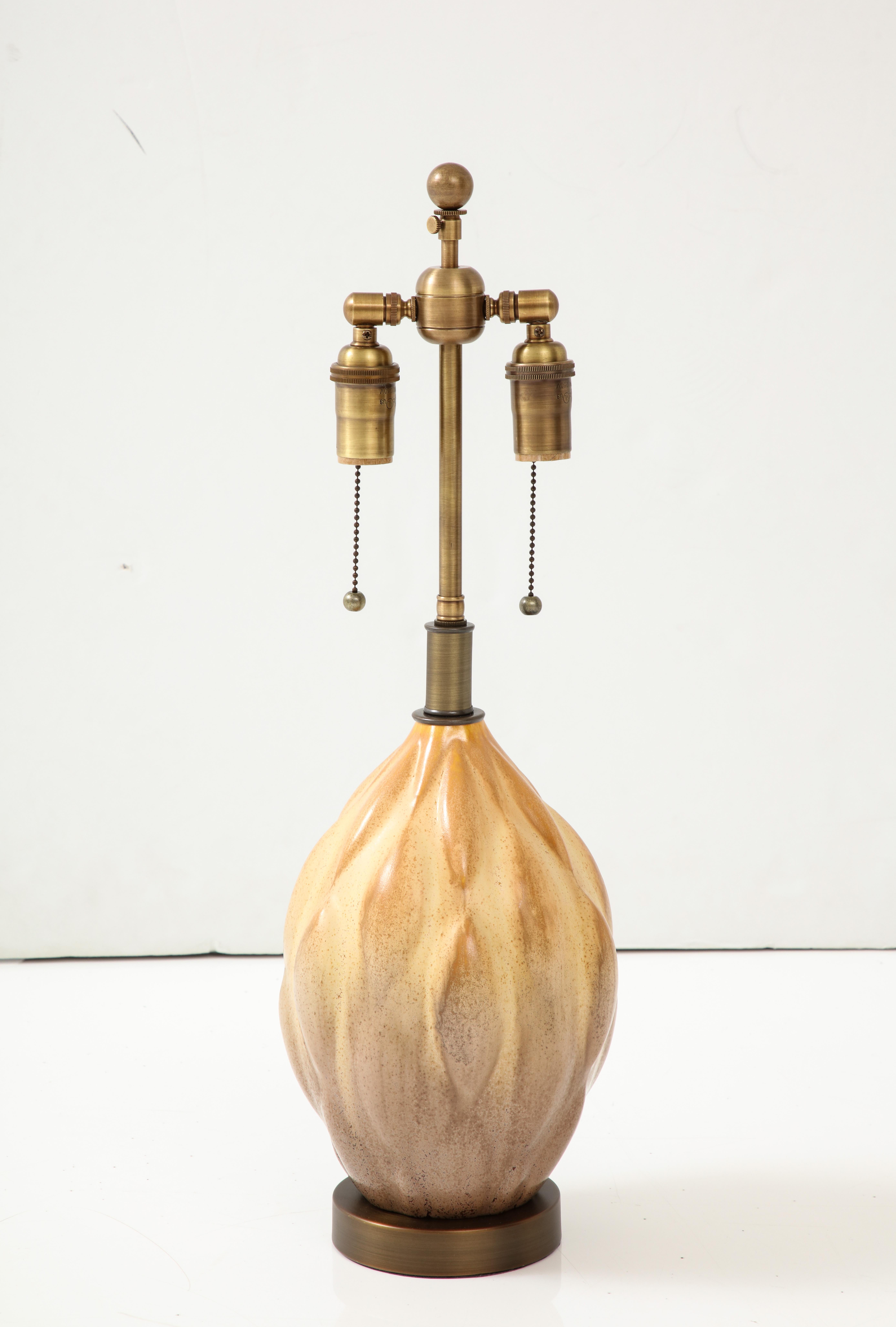 Gourd shaped ceramic lamp with an Ombre glazed finish in the 
style of Axel Salto.
The Gourd shaped ceramic sits on an Antique brass finished base and has been Newly rewired with an adjustable Antique brass finished double cluster that takes