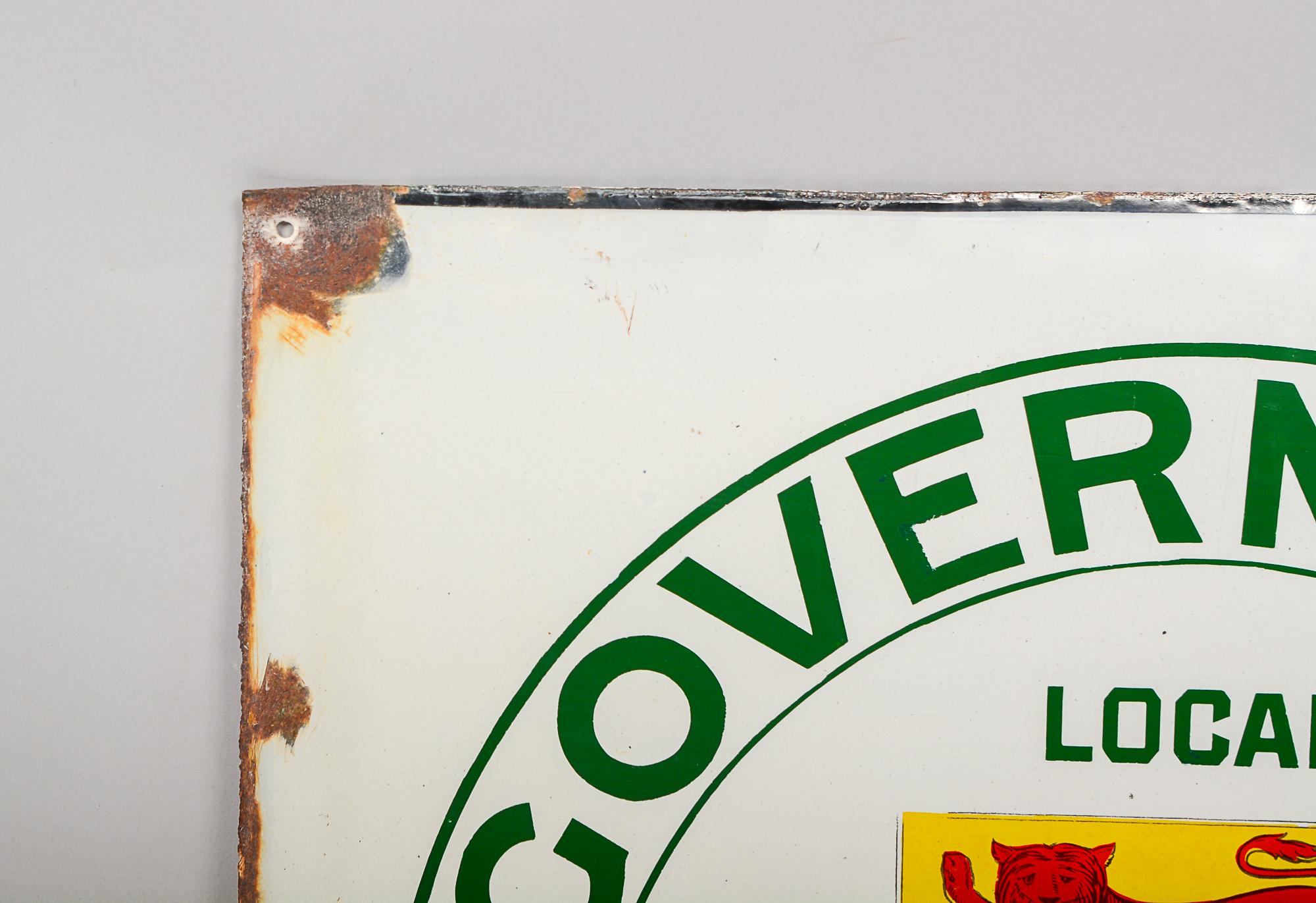 Double sided Government Telephones porcelain sign. This sign has losses in the corners and edges. There is a large loss in the image on one side.