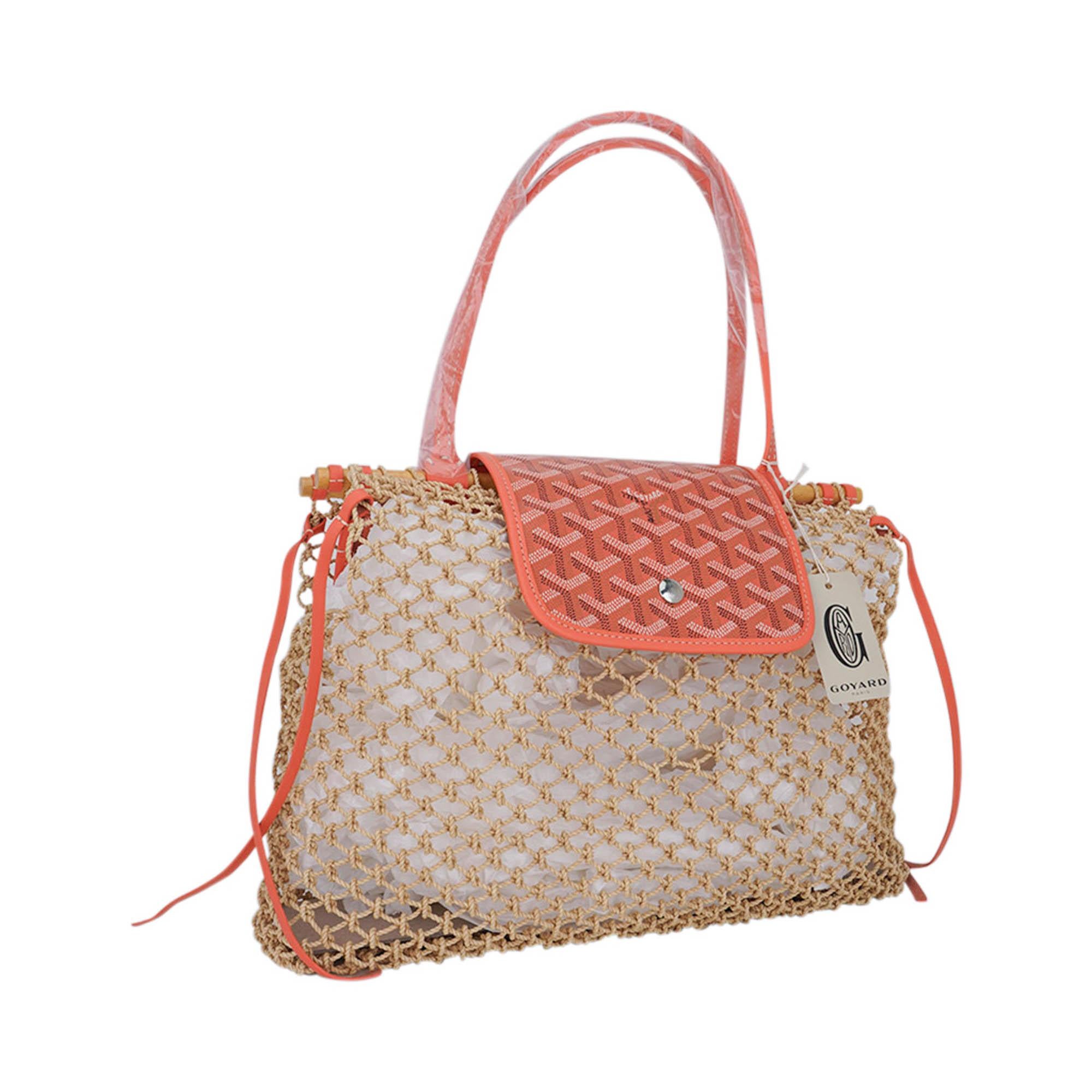 Mightychic offers a Goyard 2024 Limited Edition Aligre bag is reissued for 2024 in Coral.
The Aligre bag, made with hand braided raffia mesh and a Goyardine canvas flap with snap closure and leather trimmings,
is reminiscent of the netted shoppers