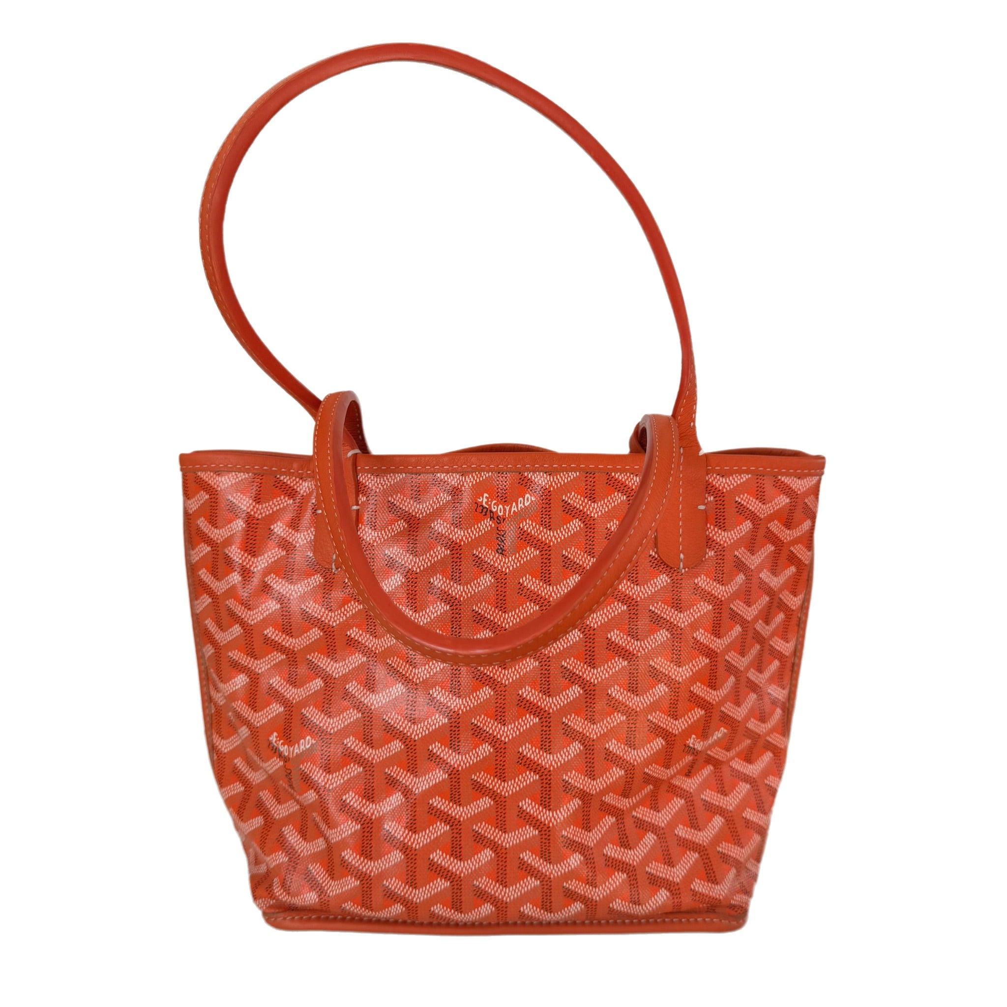 Goyard Anjou Mini Tote Orange Canvas and Leather, 2018
 These are professional photos of the actual bag.
 This Goyard Anjou Tote mini is an iconic piece of French craftsmanship, expertly fashioned from Goyardine printed canvas and lambskin leather.