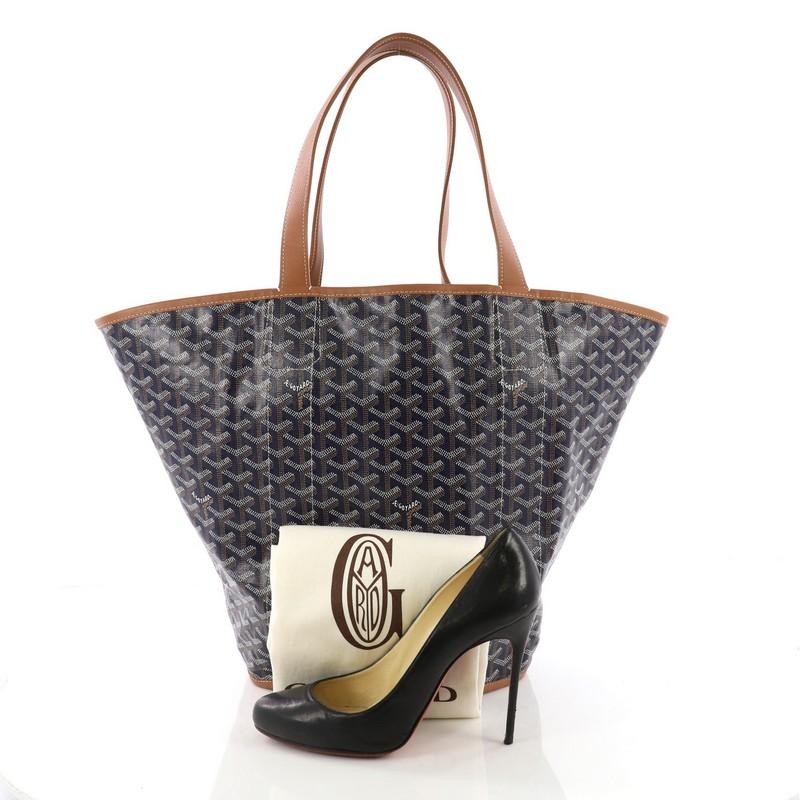 This Goyard Belharra Biarritz Tote Coated Canvas, crafted from black coated canvas, features dual flat handles. It opens to a beige canvas interior. **Note: Shoe photographed is used as a sizing reference, and does not come with the bag.