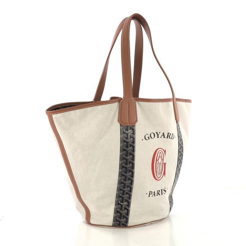 This Goyard Belharra Reversible Tote Coated Canvas, crafted from beige canvas and black Goyardine coated canvas, features dual flat handles and leather trim. It opens to a reversible interior. 

Condition: Very good. Color transfer on base,